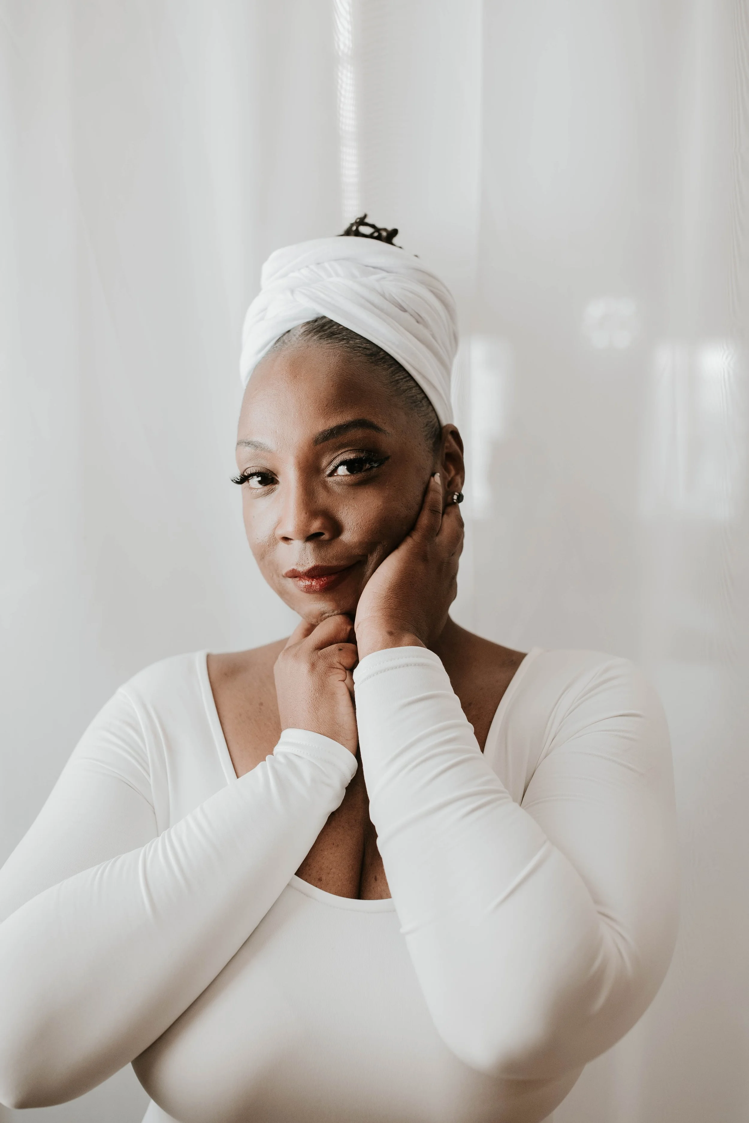 Towanda Carrigan in a calm and centered portrait representing self-alignment, leadership, and divine purpose through the 2Wanda Community Foundation