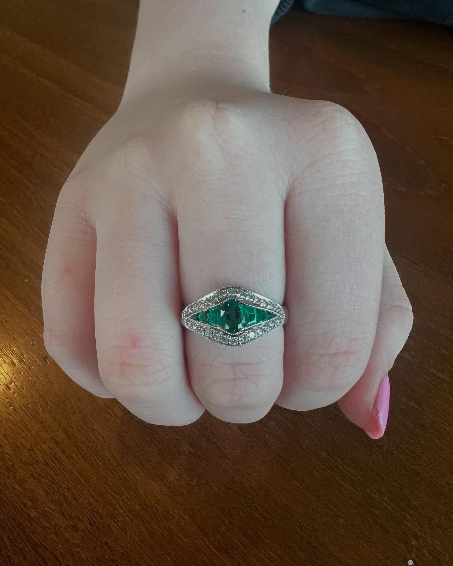 Today&rsquo;s featured auction piece: an art deco style emerald and diamond ring, set in 18K white gold. The deep green emeralds, accented by shimmering diamonds, create a look that is both bold and sophisticated&mdash;perfect for lovers of vintage.
