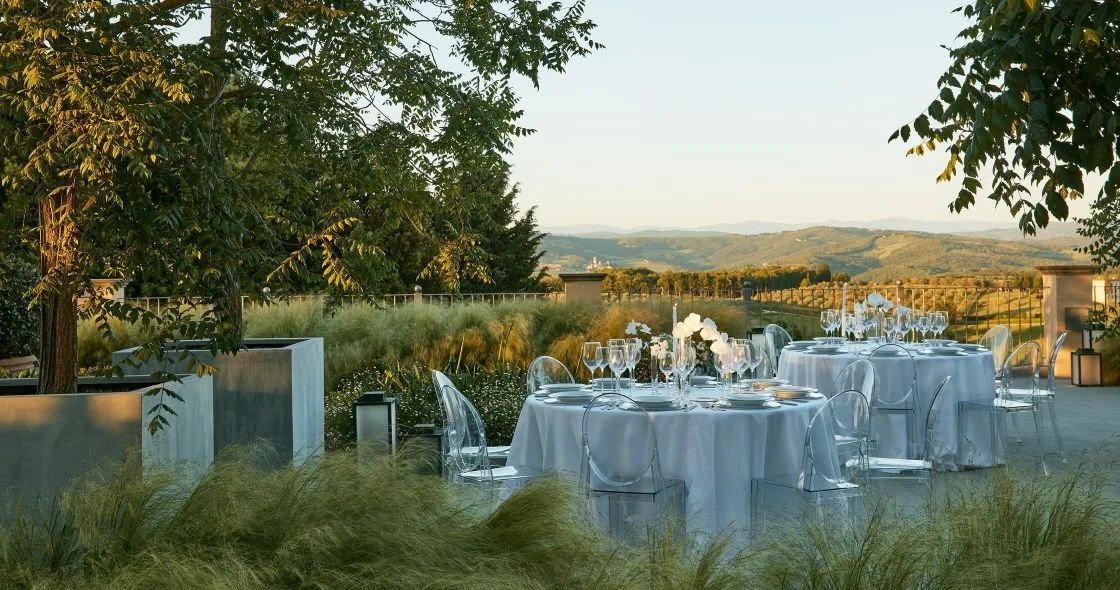 A wedding party/reception held outdoors on the COMO Castello Del Nero property in Tuscany, Italy