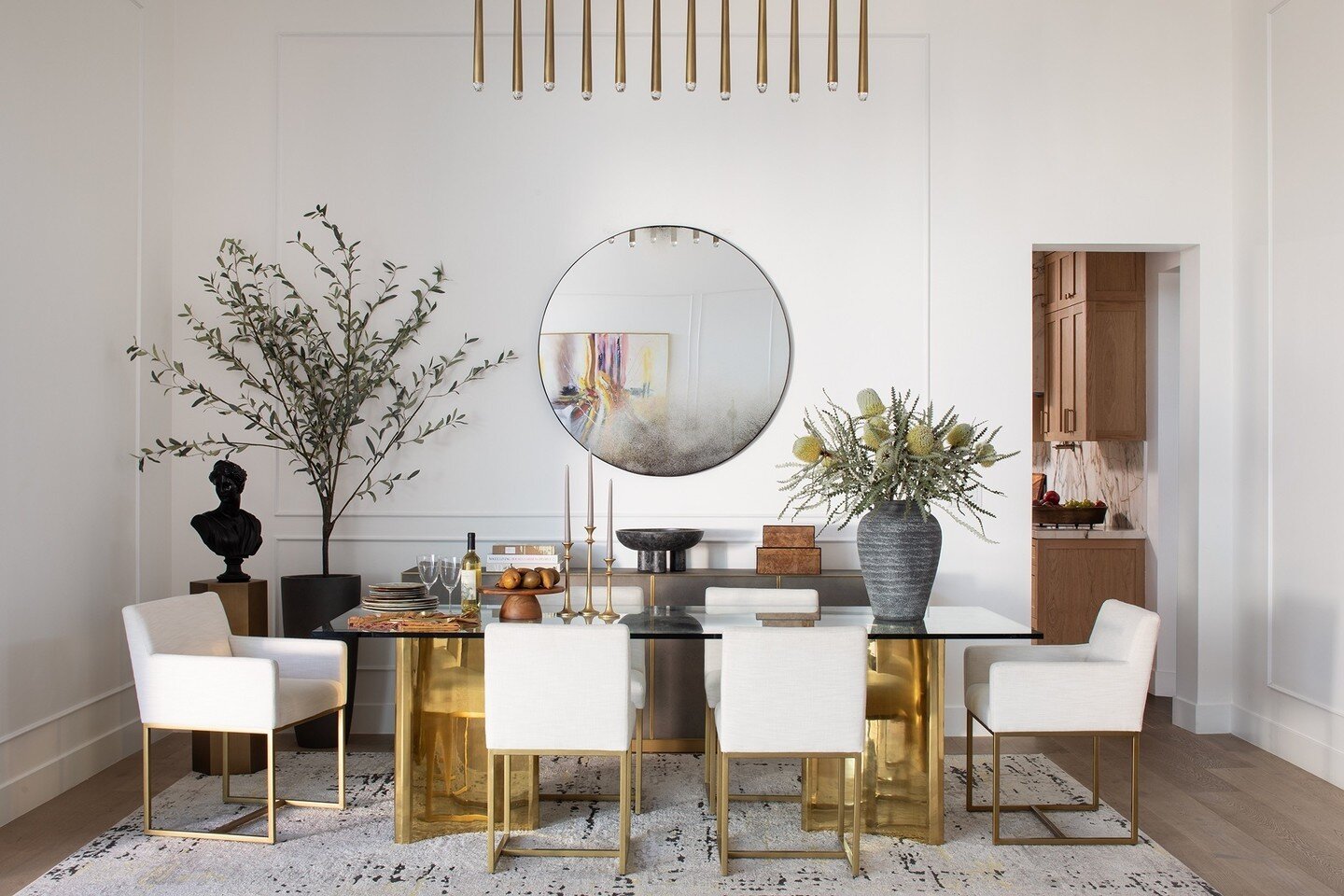 I'm excited to share a home that has been a long time in the making! We had a great time designing this modern dining room for an incredible family. We selected furniture with sleek, clean lines and brought in different materials like brass, glass, a