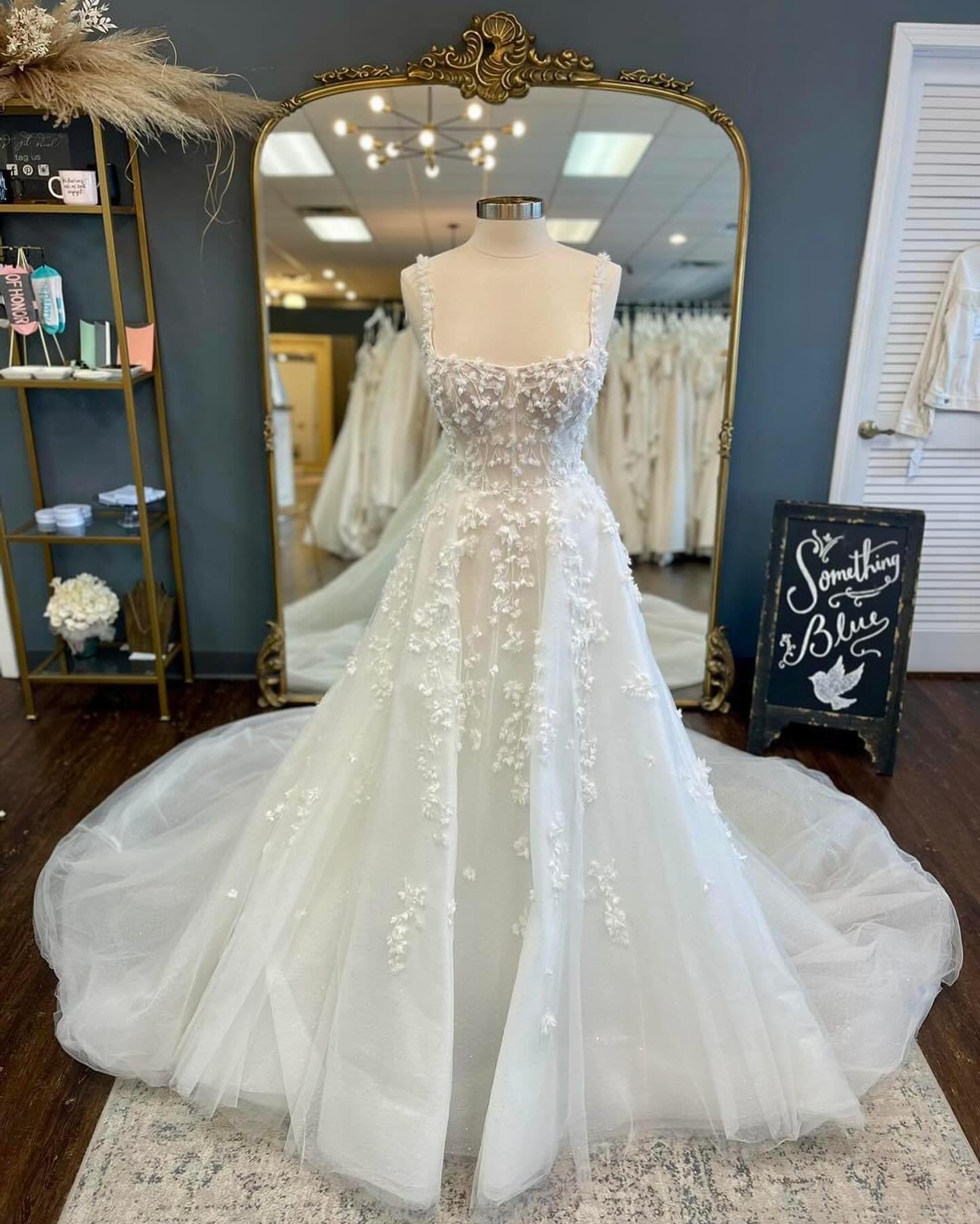 Brand new just in time for #WeddingGownWednesday! 

This stunning new ballgown features a square neckline, fun 3D florals and beautiful sparkles throughout! She is absolutely gorgeous!! You can try this dress on in store in a size 14 and we can order