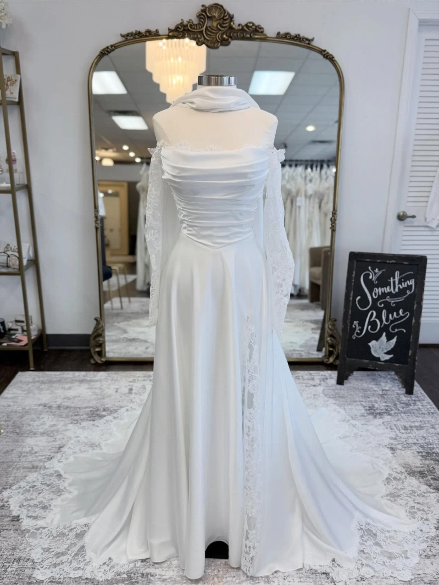 Effortlessly chic &amp; endlessly romantic🤍✨

This week&rsquo;s #weddinggownwednesday dress is made with silky charmeuse fabric with Chantilly lace accents, sleeves and a leg slit! 🤍

Designer: @madilanebridal 

#wgw #somethingbluebridal 

Wedding 