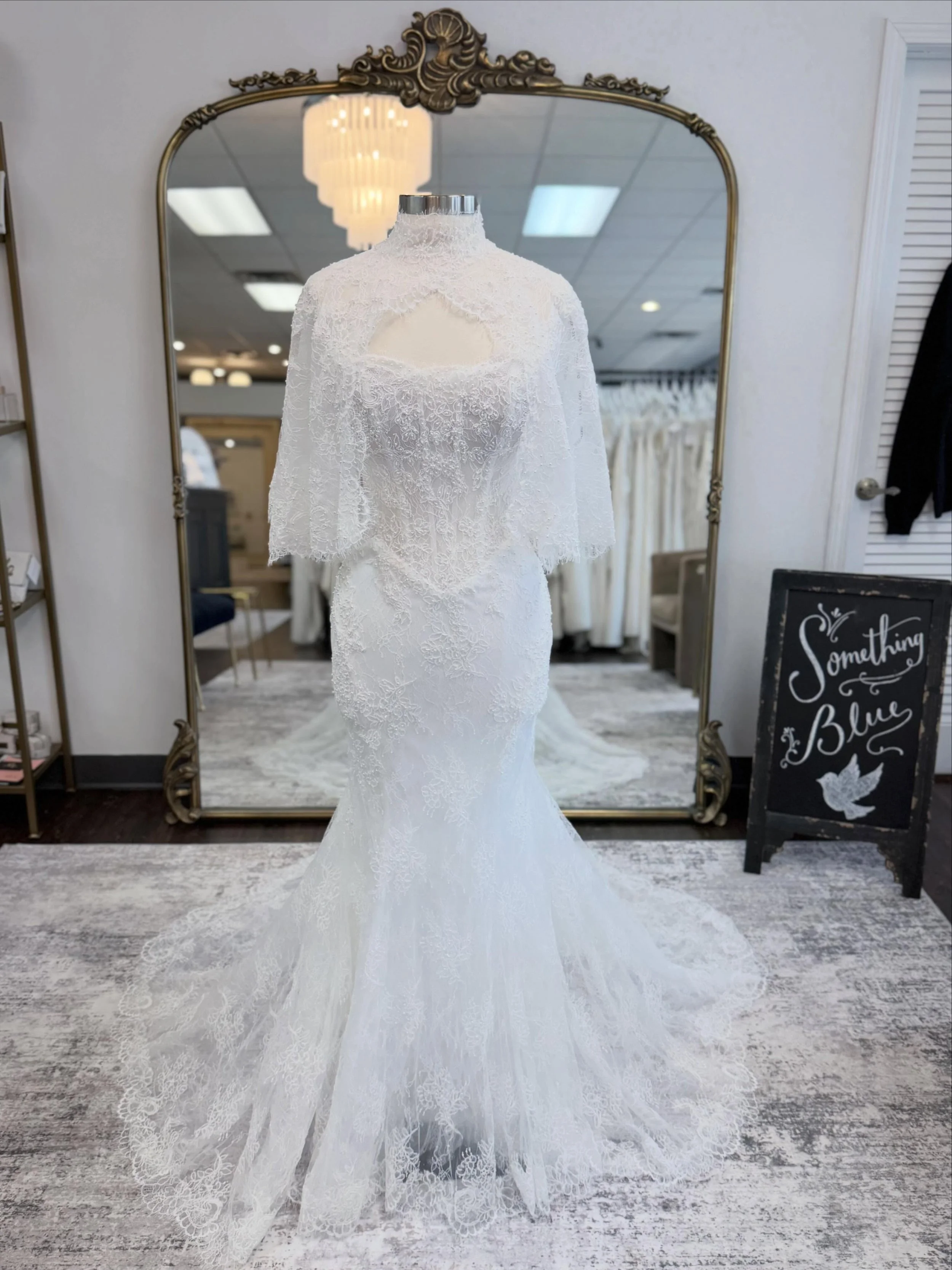 She brings the DRAMA!✨

This stunning new @martinalianabridal arrived just in time for #weddinggownwednesday! This gorgeous, fitted lace gown features the cutest detachable cape, a sprinkling of pearls throughout, and a basque waistline! Did we menti