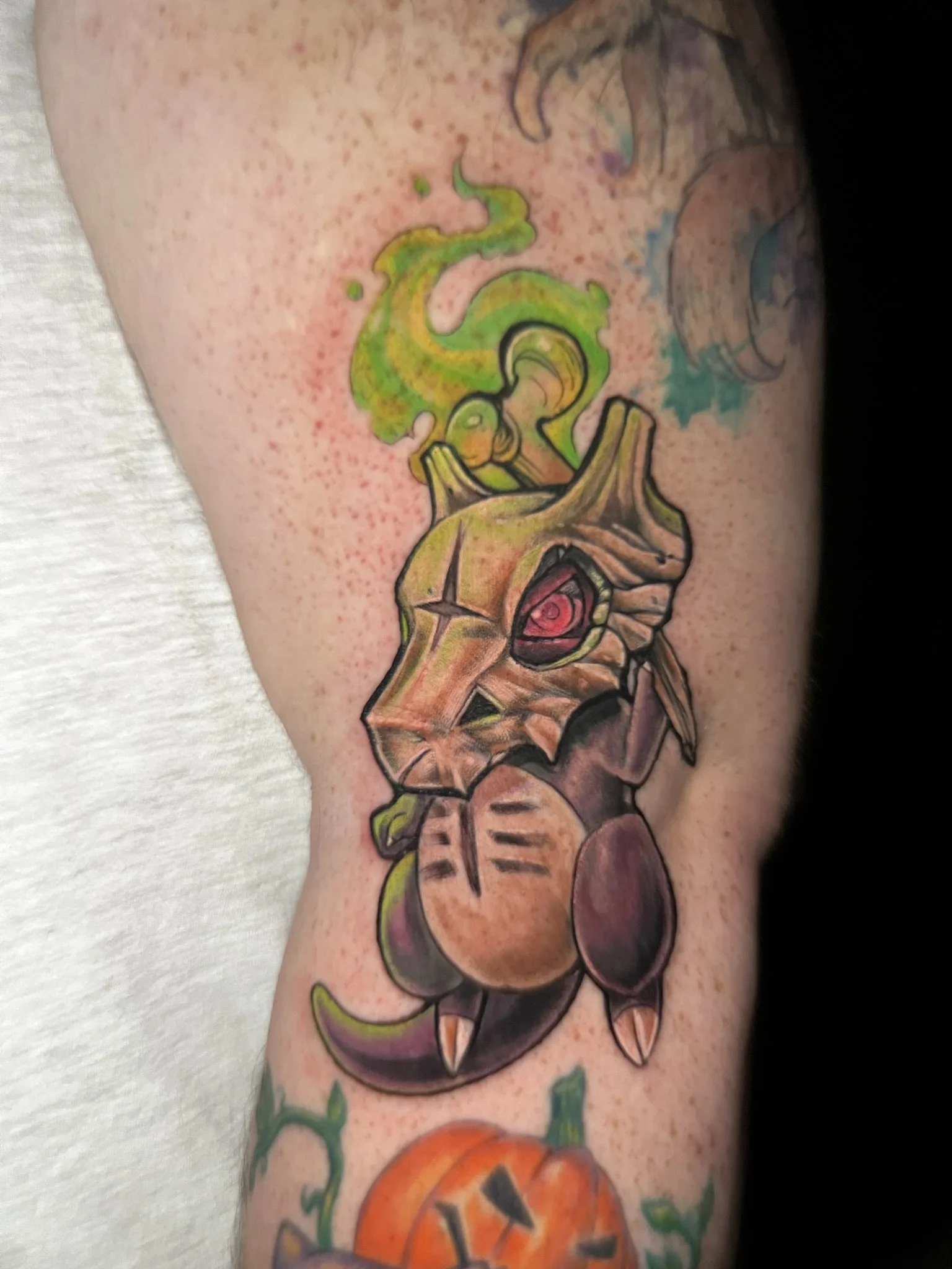 full color saturated anime gamer tattoo of pokemon aholan cubone done by sterling gorejus done at easy tiger tattoo in merrillville indiana