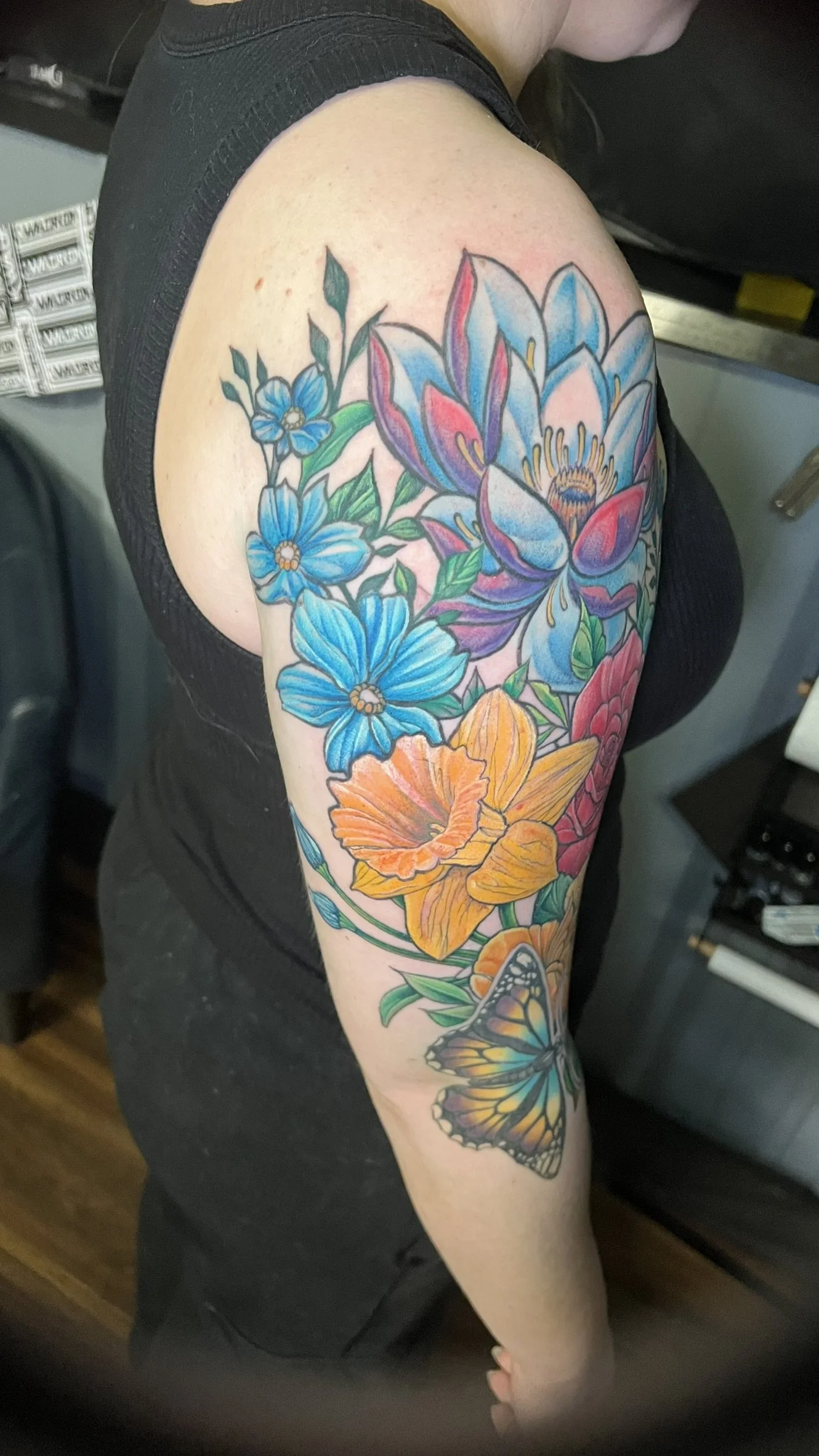 fill color saturated neo traditional flowers done on the arm by sterling gorejus in merrillville indiana at easy tiger tattoo studio