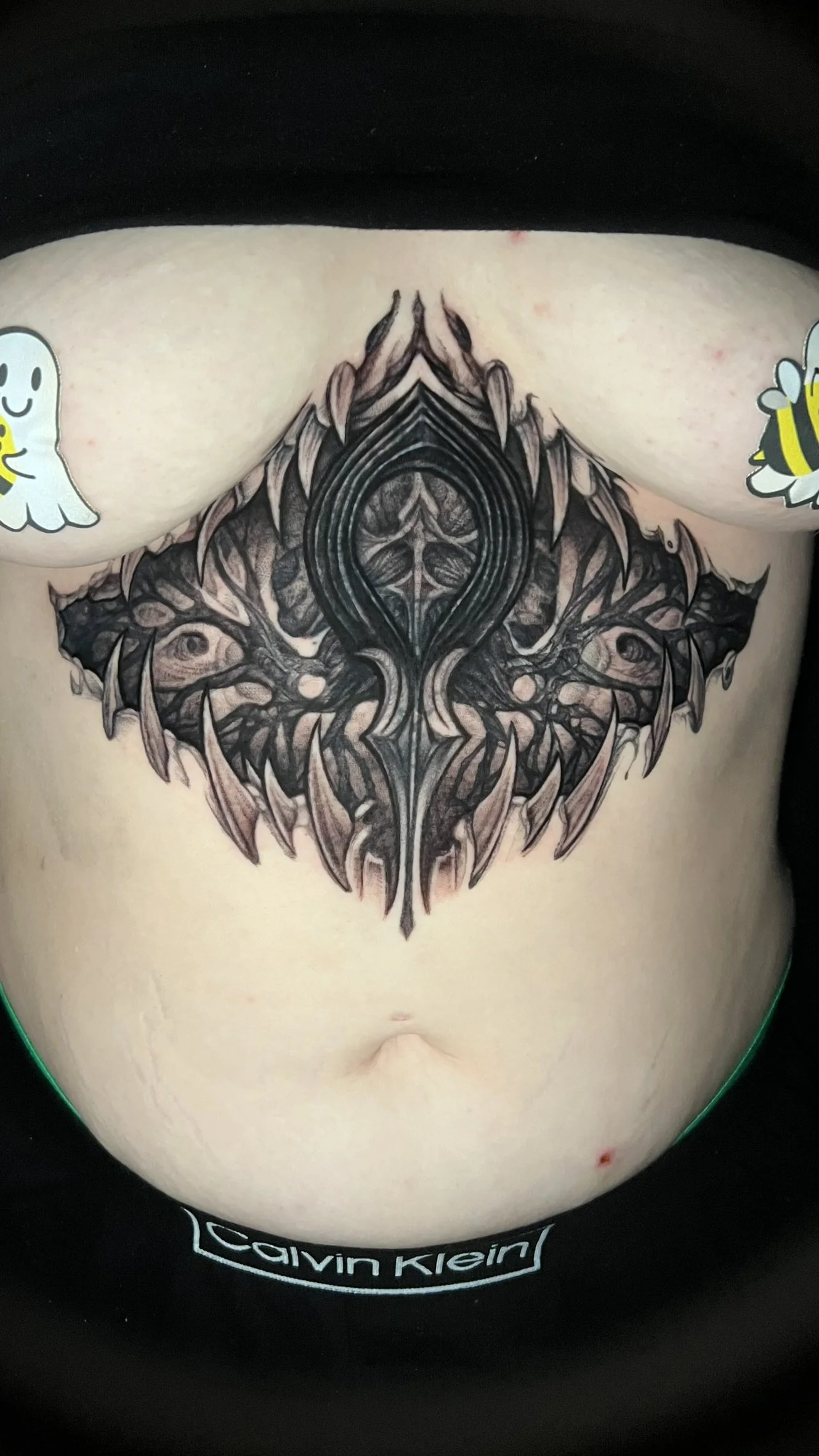 dark bio organic blackwork ankh done on the sternum by sterling gorejus at easy tiger tattoo in merrillville indiana
