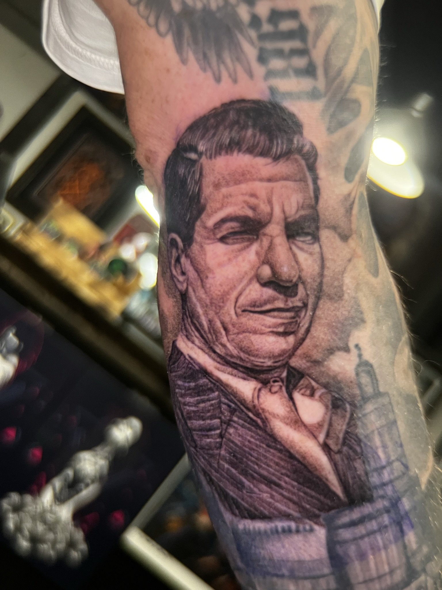 blackwork pointillism tattoo of lucky luciano done by sterling gorejus in mirrillville indiana at easy tiger tattoo