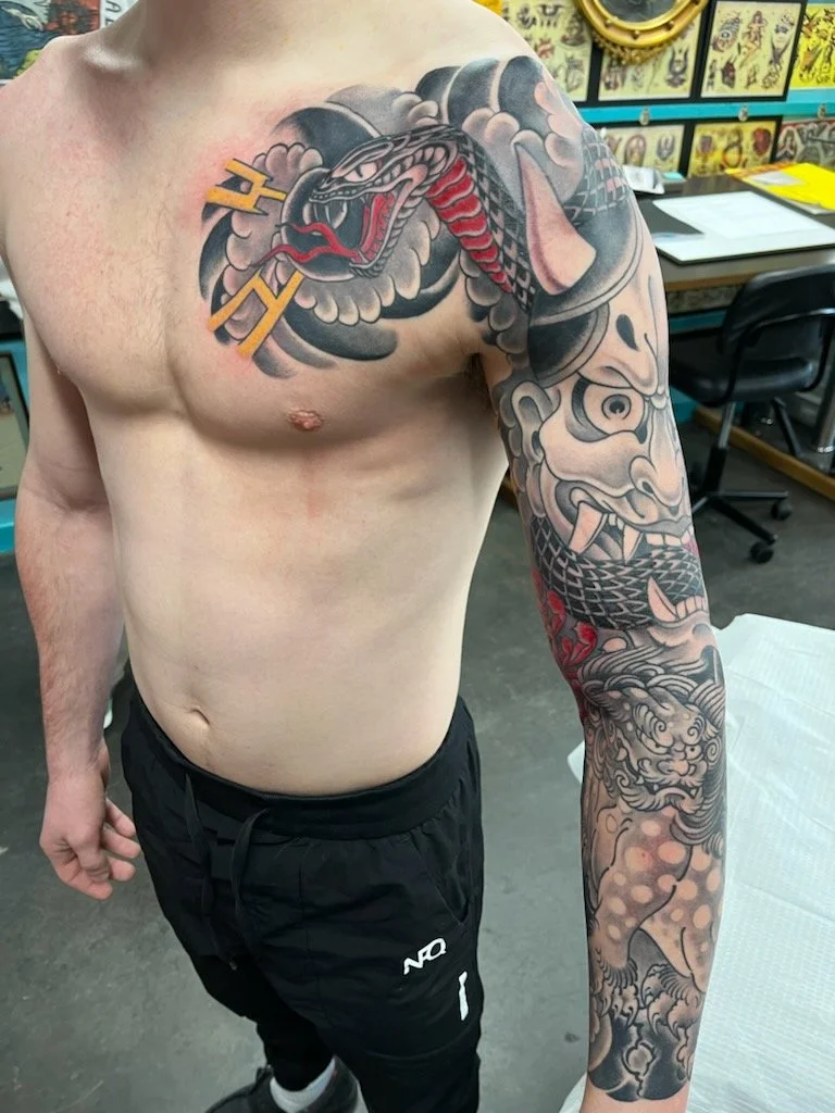 Japanese Black and grey with color Hannya M ask done by Cody Wallenius at Easy Tiger Tattoos In Merrillville Indiana