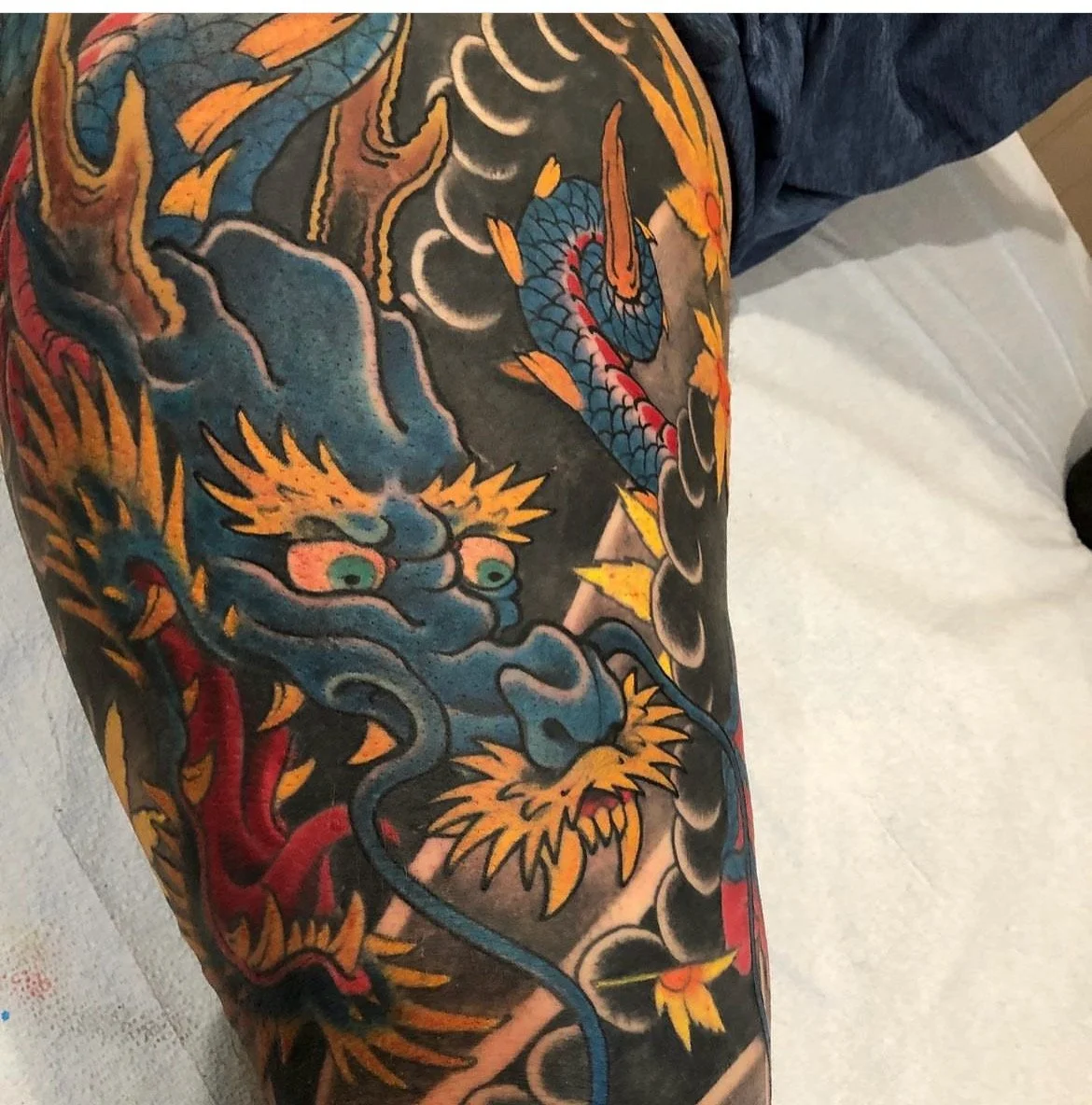 colored traditional japanese dragon tatoo done by cody wallenius at easy tiiger tattoo in merrillville indiana