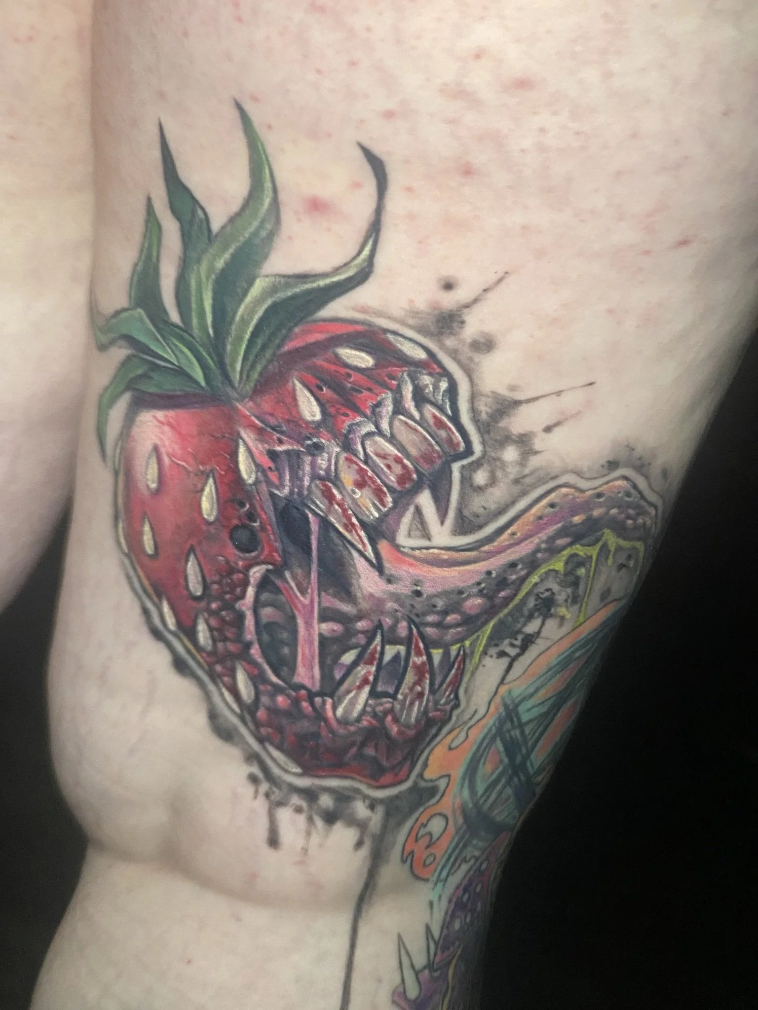 full color saturation hungry strawberry surrealism tattoo  done by sterling gorejus in merrillville indiana at easy tiger tattoo
