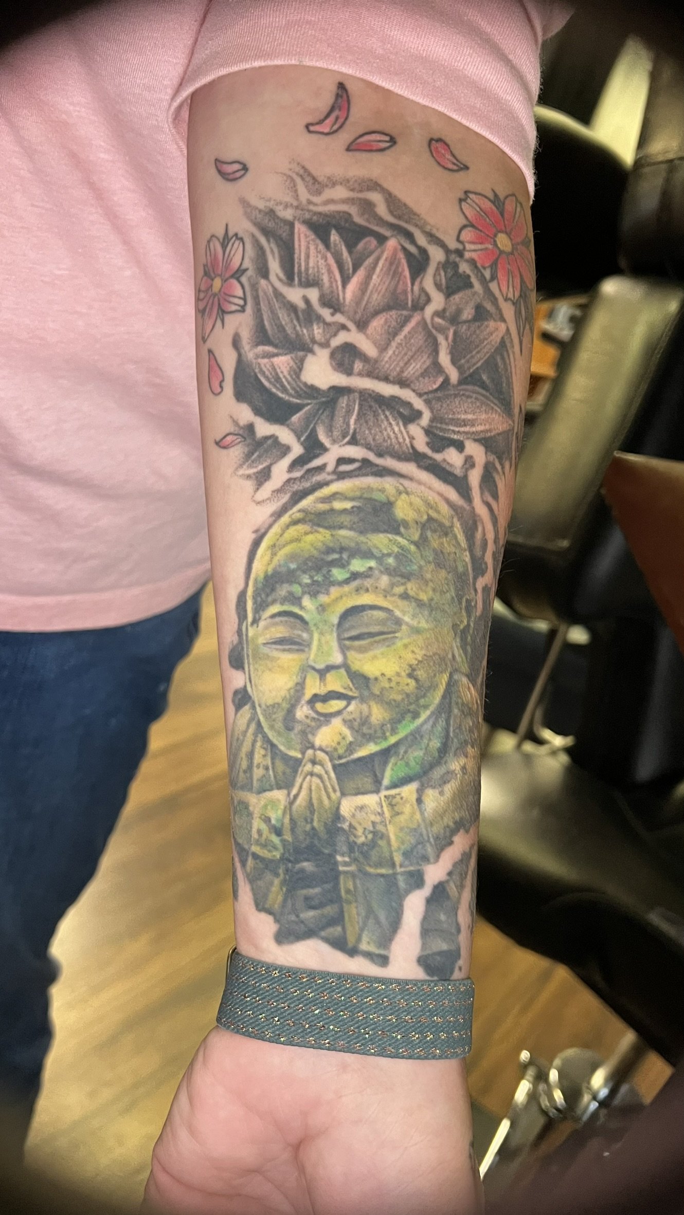 fill color and blackwork mossy jizo statue done on the arm by sterling gorejus at easy tiger tattoo in Merrillville indiana