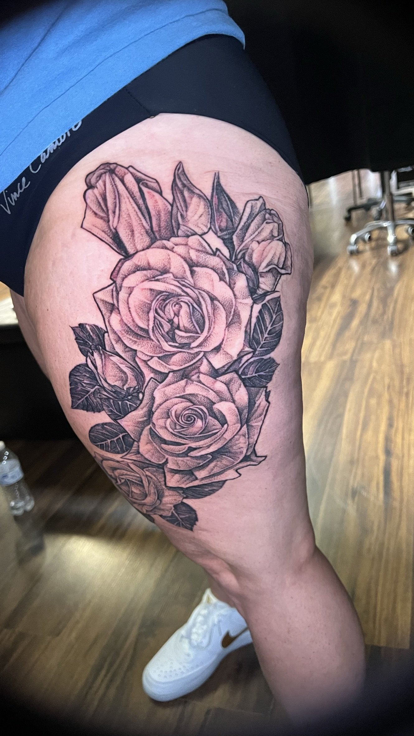 blackwork pointillism roses done on the thigh by sterling gorejus at easy tiger tattoo studion in merrillville indiana