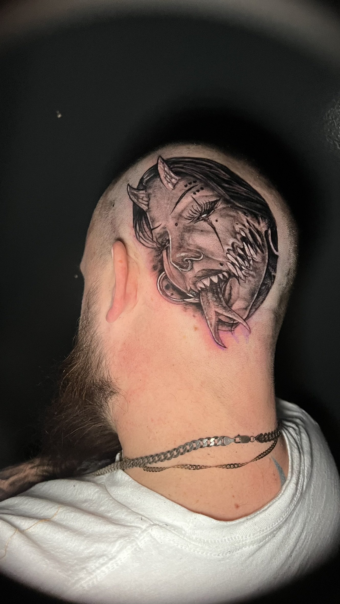 black in grey demon portait done on the head by sterling gorejus at easy tiger tattoo in merrillvill indiana