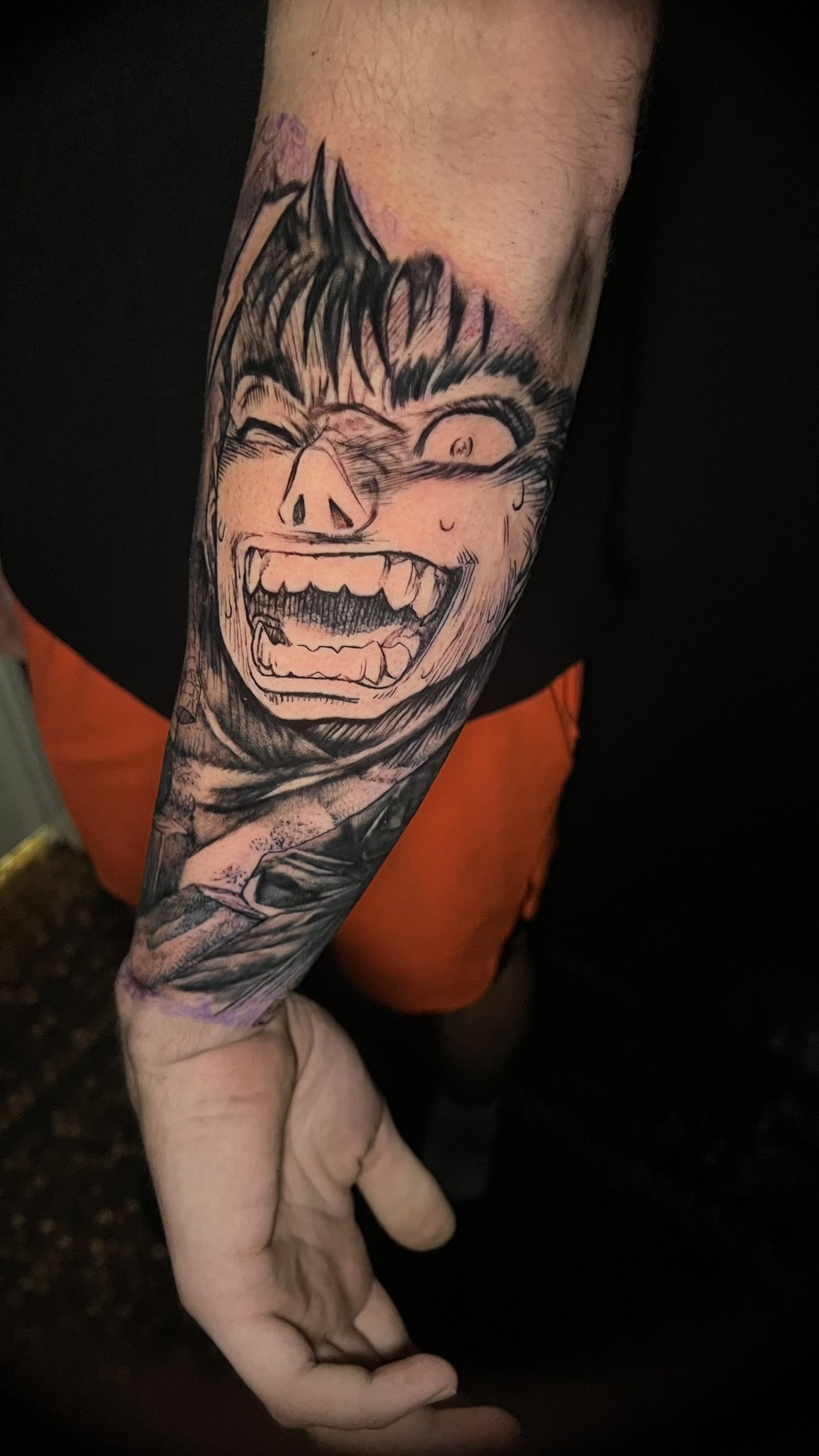 blackwork anime tattoo of guts from berserk quarter sleeve done by sterling gorejus at easy tiger tattoos in merillville indiana