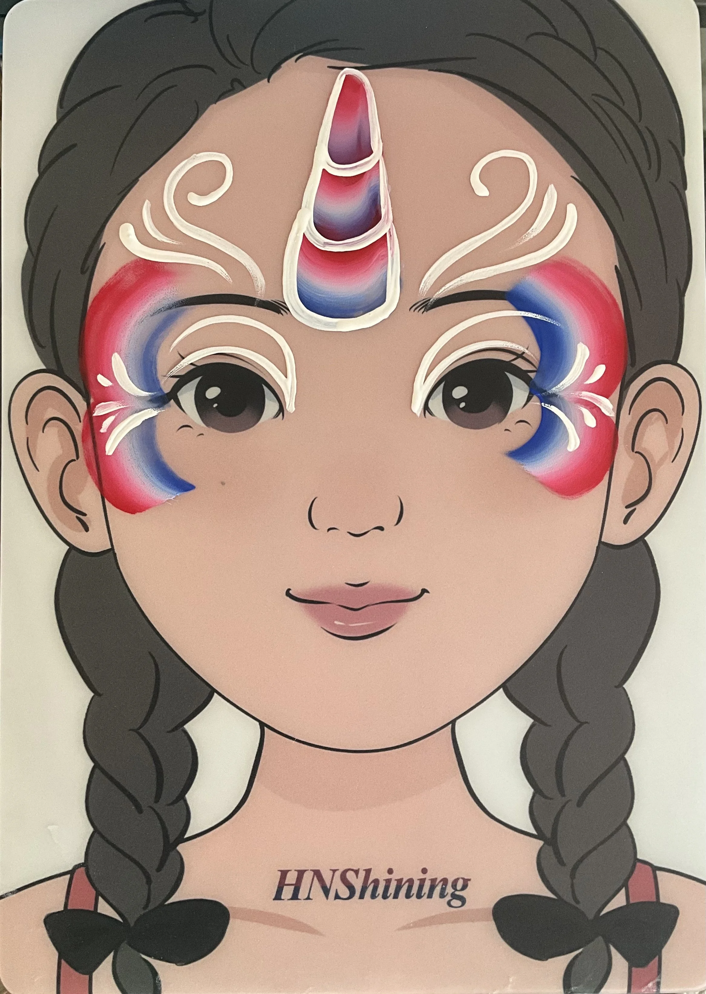 A cartoon girl with braids and a painted unicorn horn on her forehead, wearing a pink top with the text 'HNShining' on it.