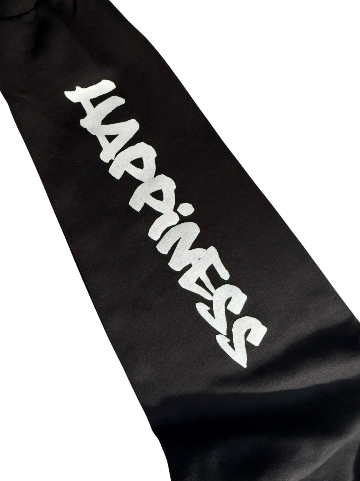 Black Fabric Item Featuring Bold Graffiti 'HAPPINESS' Text.png