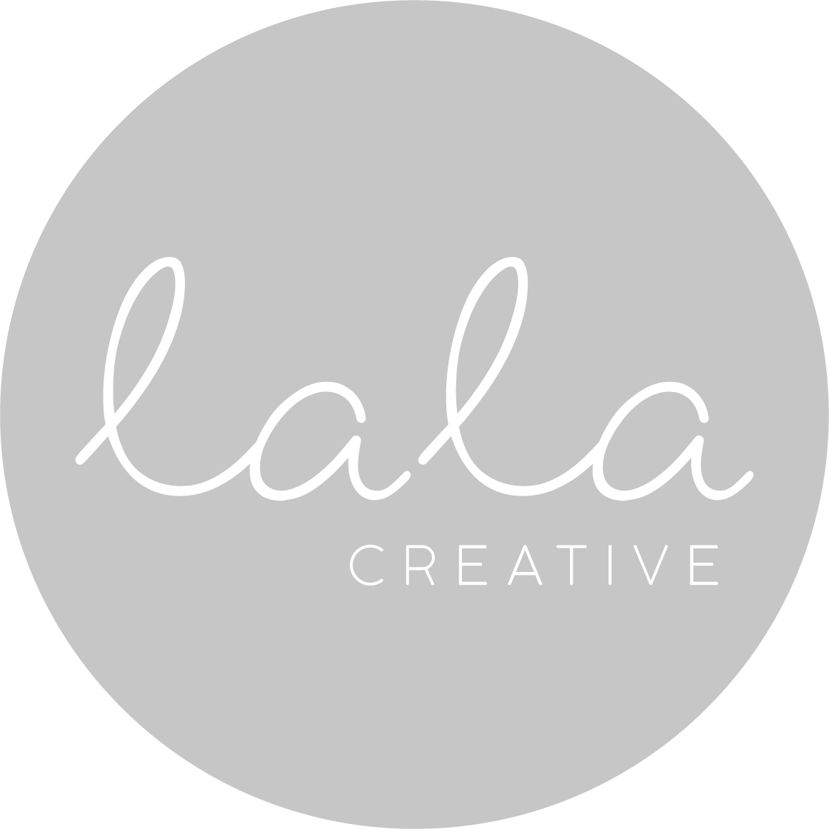Logo with the words "Lala Creative" in a stylish font inside a gray circle.