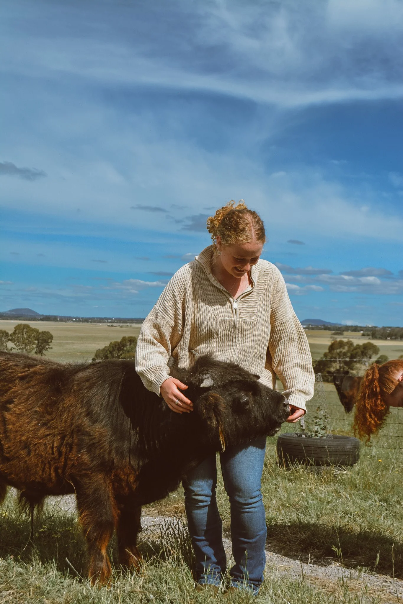 Chelsea from Hayes Girl Highlands Cuddling a highland cow.