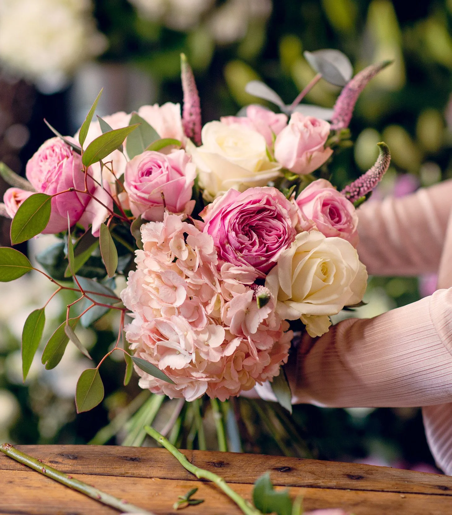 Hayden Blest a leading florist in Hong Kong arranging a flower bouquet