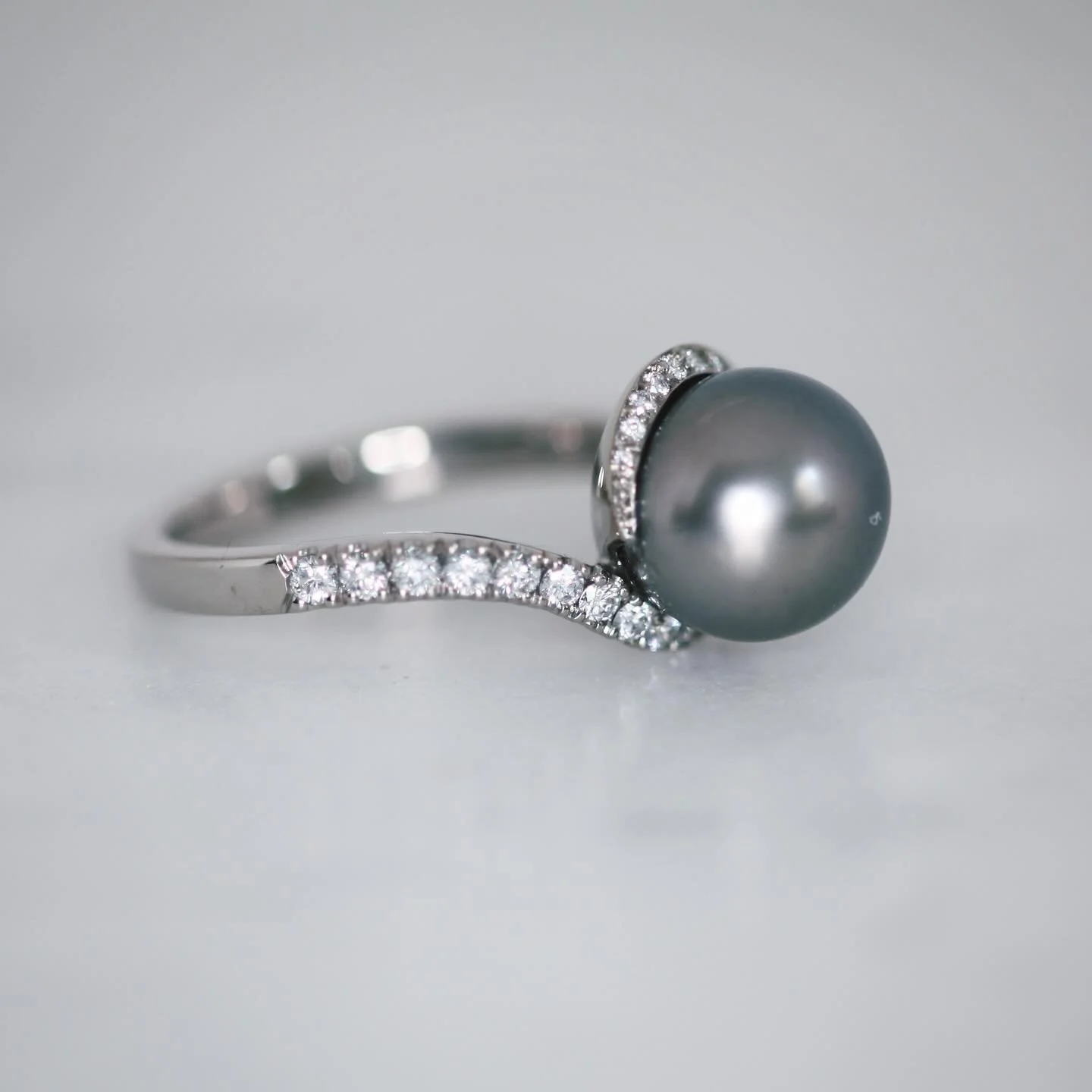 18ct white gold, diamond and pearl ring.

I made this piece a little while ago &mdash; hand-carved from wax, cast in gold, and set with a sweeping line of graduated brilliant-cut natural diamonds. ✨
The pearl has a lovely story too: it once belonged 