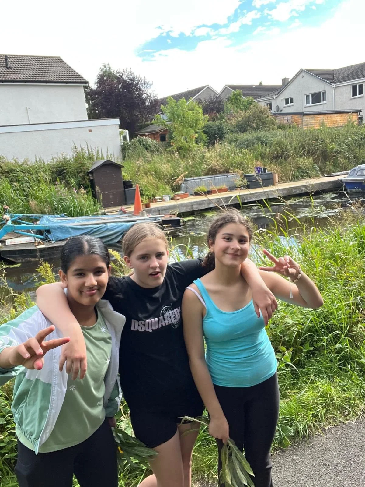 Three young women smiling