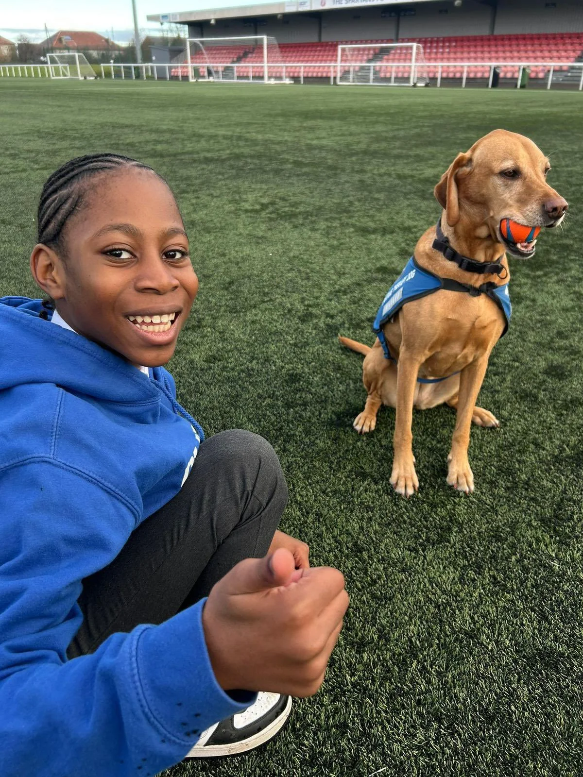 Young person with a therapy dog