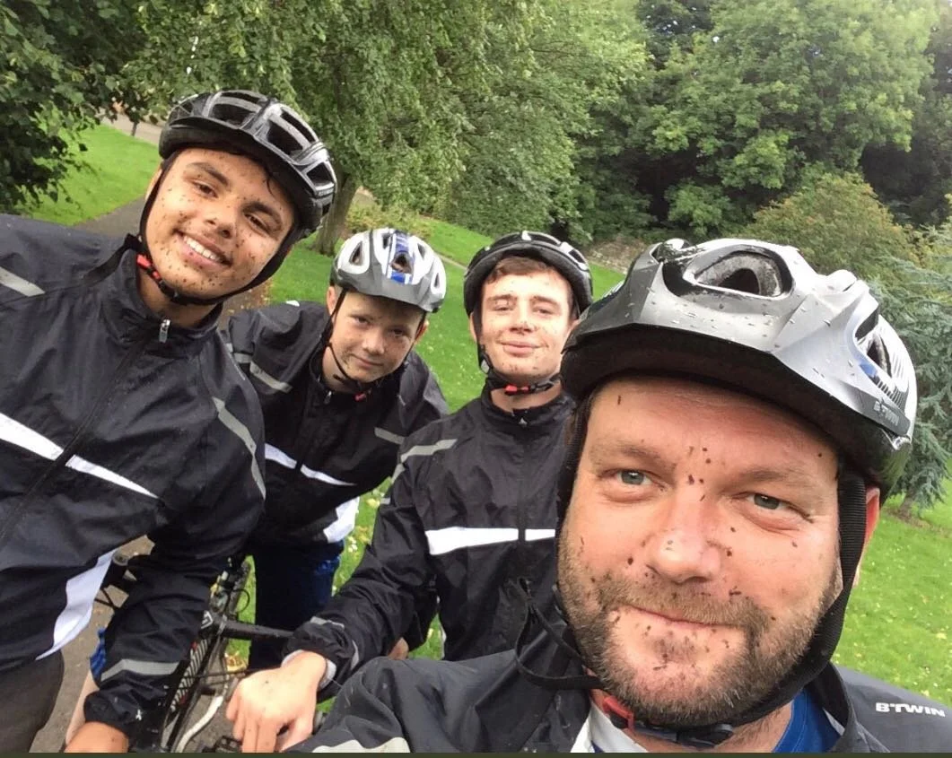 Youth workers with young people on mountainbikes