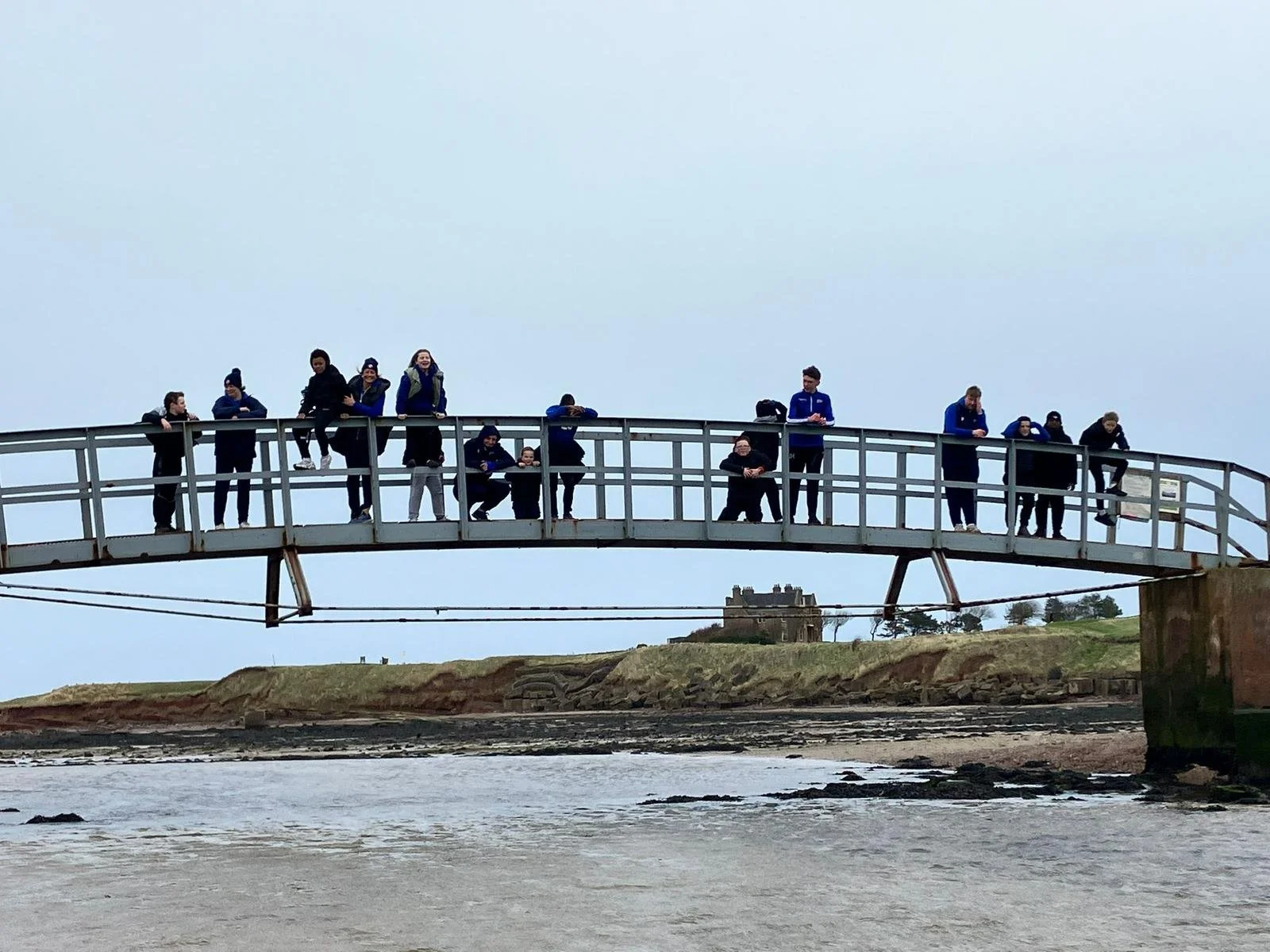 Group of young people on a bridge