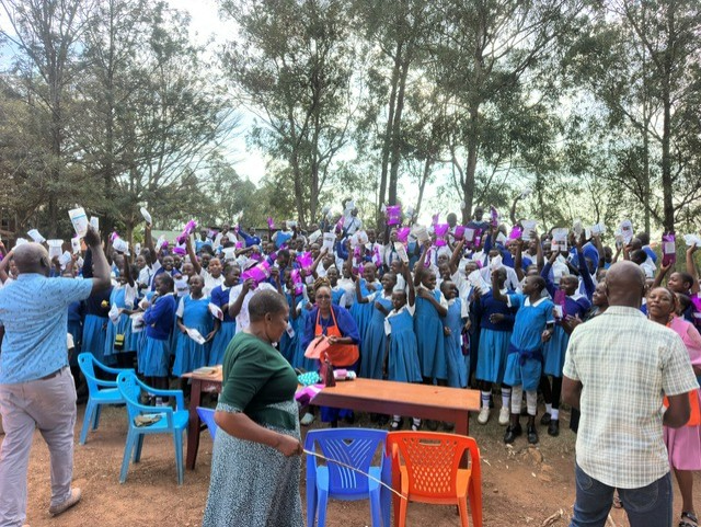 Women receiving Days for Girls Kits