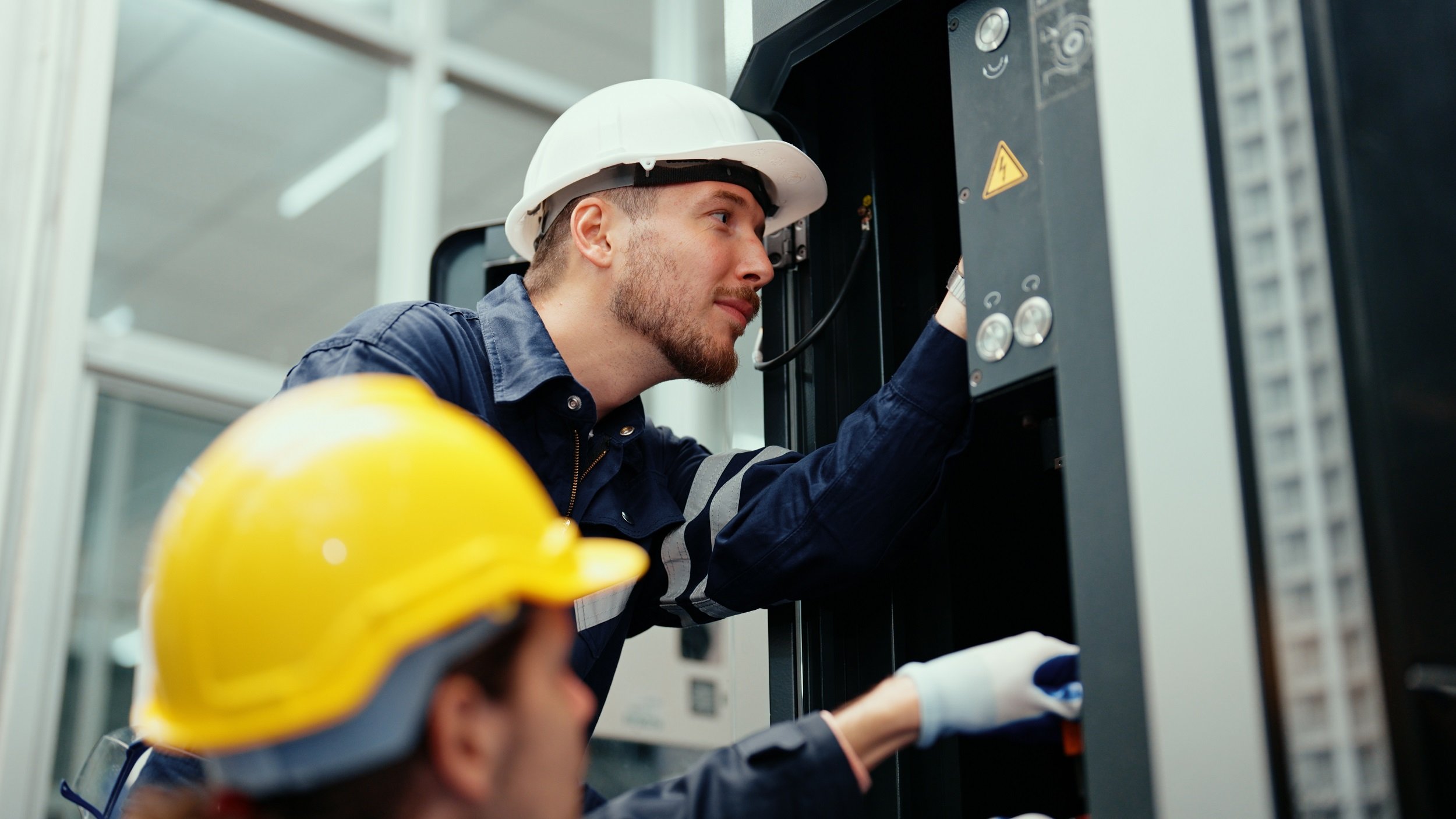 HVAC technicians working together.jpeg