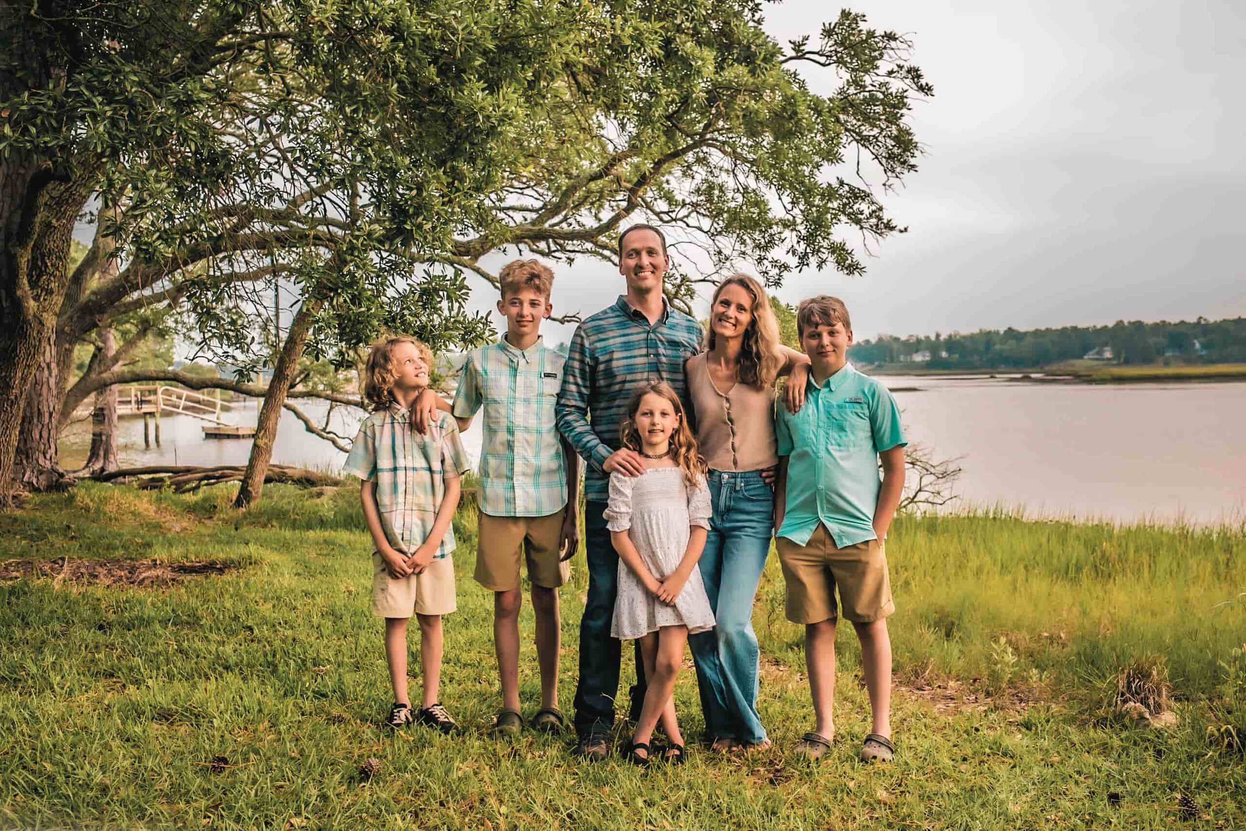 Aaron Alexander standing with his family