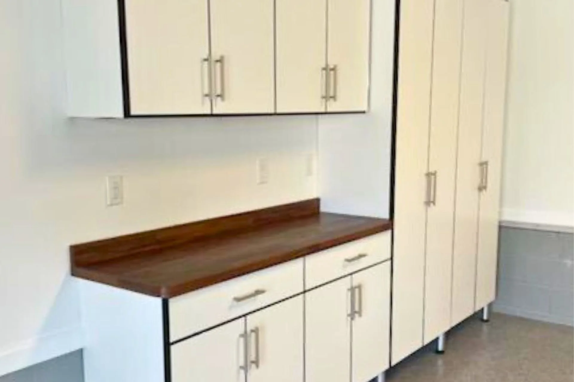 White built-in garage cabinets and drawers