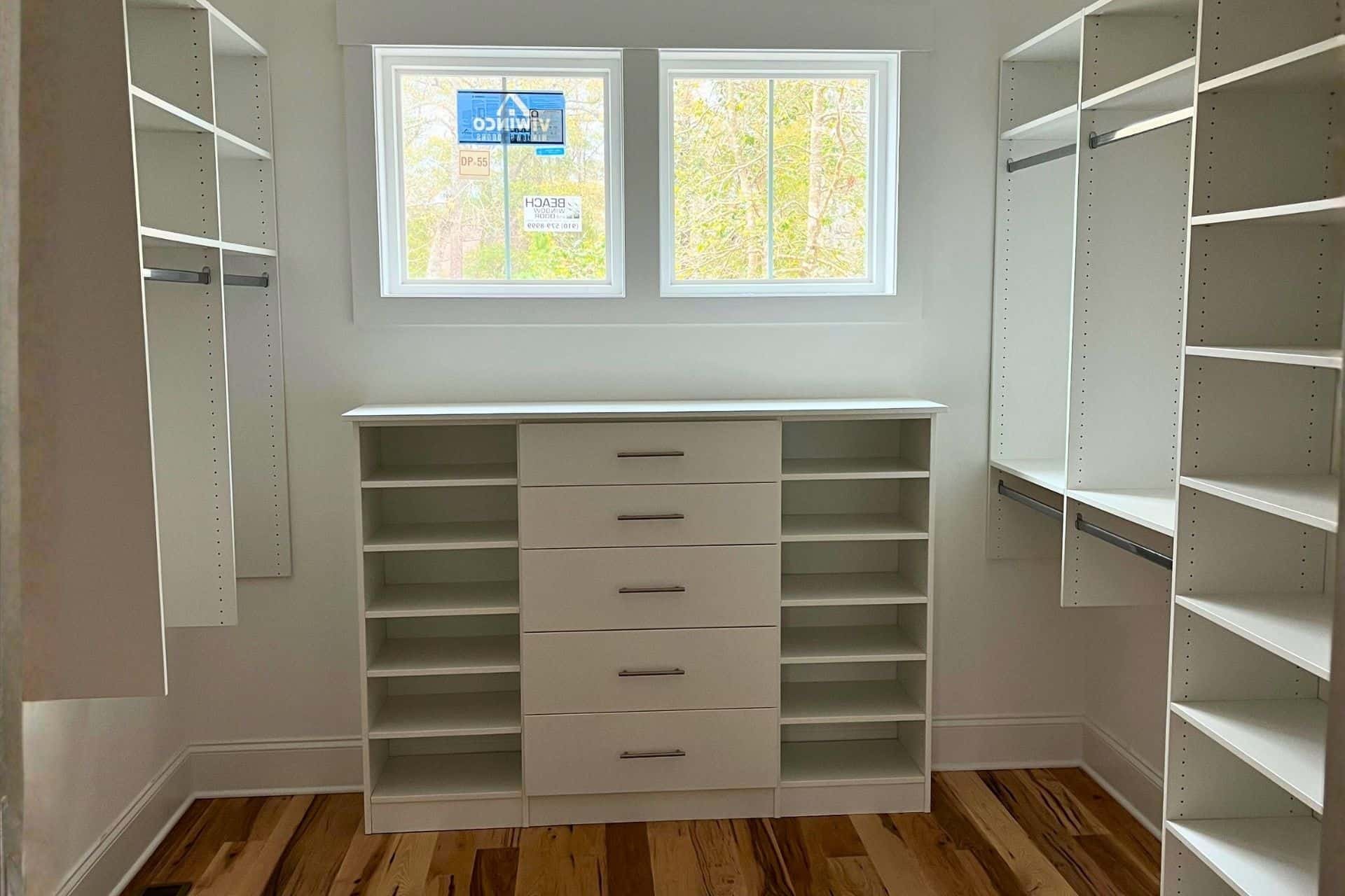 New home with custom closet and a window
