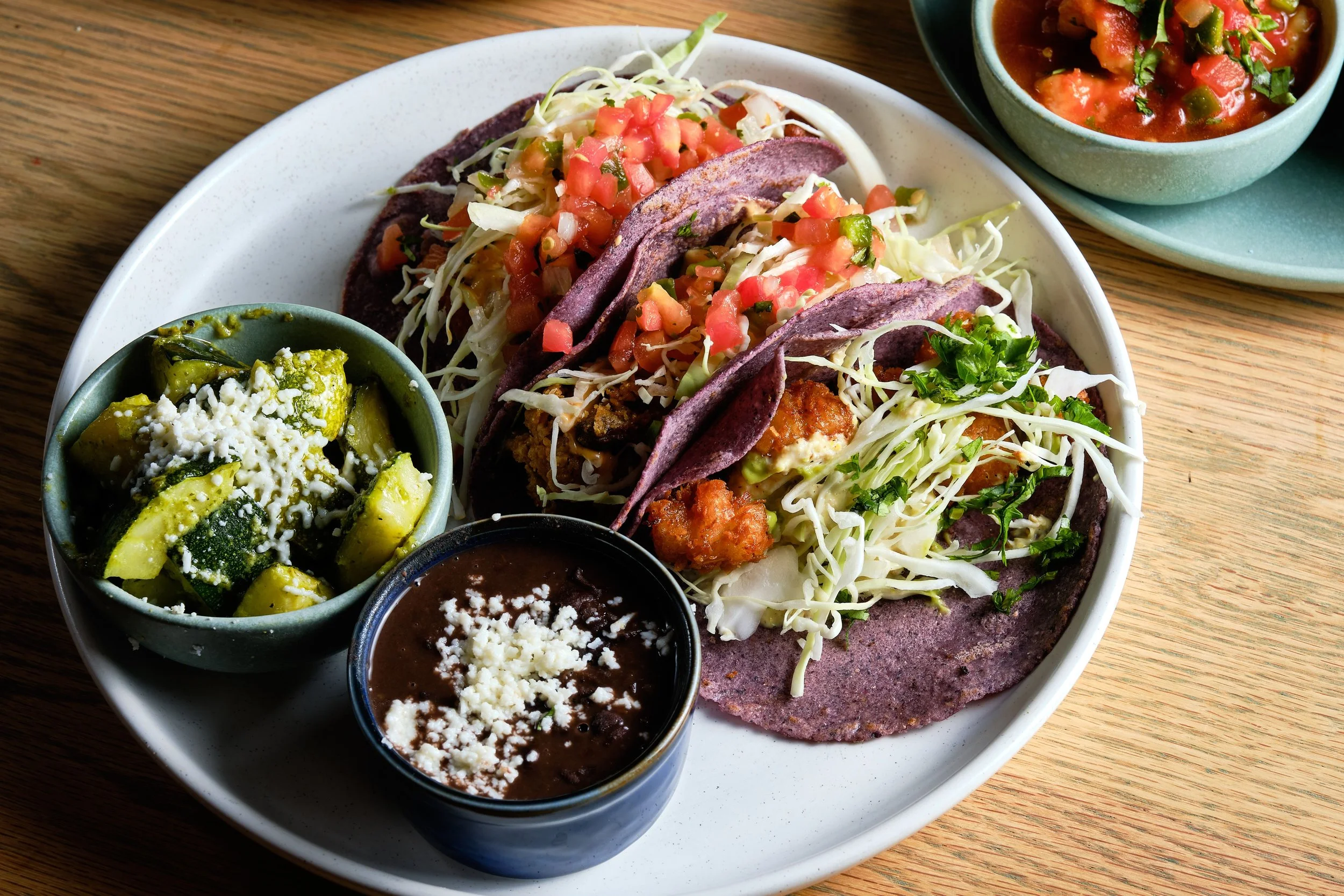 Tacos served on our signature handmade, organic, non-gmo blue corn tortillas