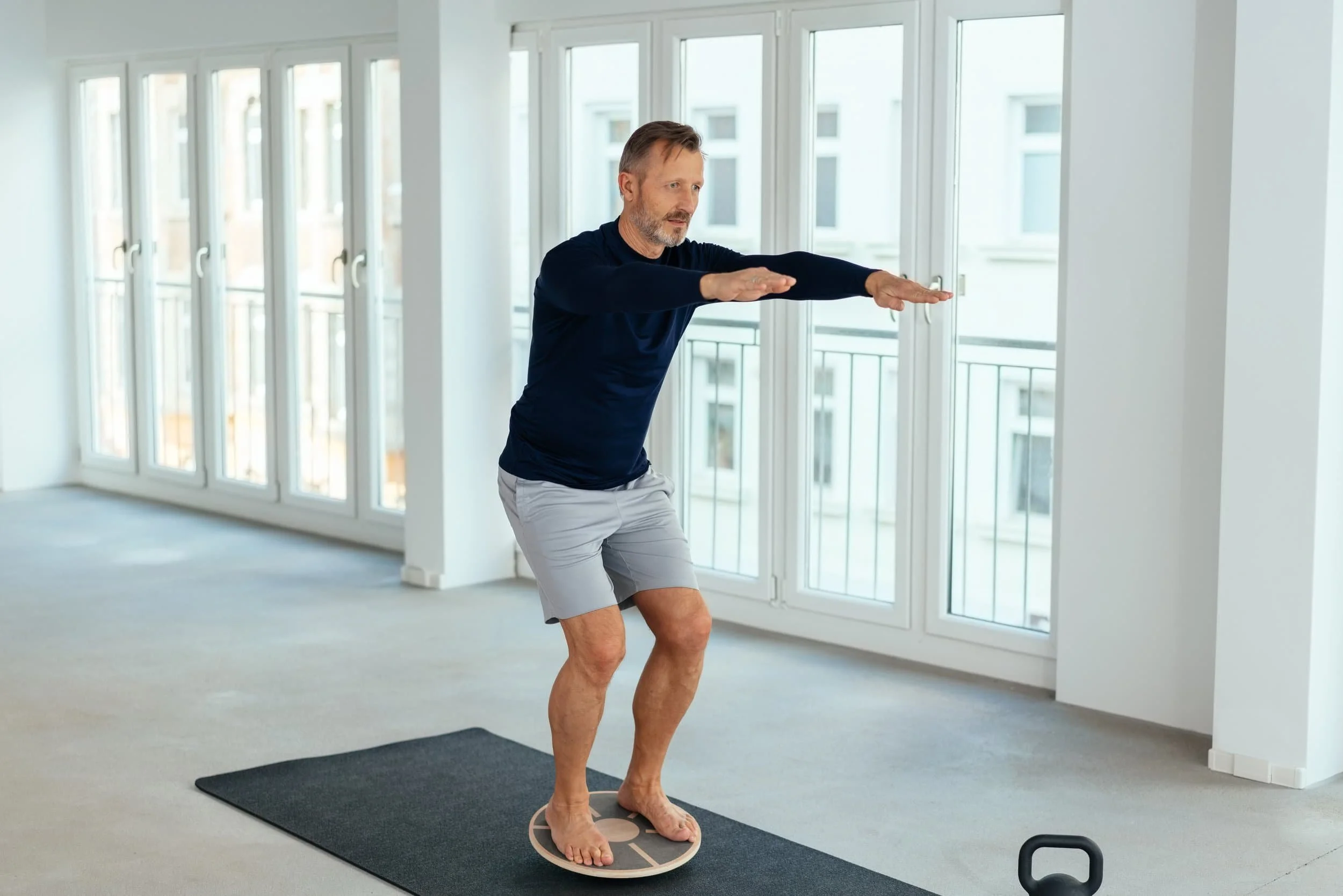 Man balancing on wobble board