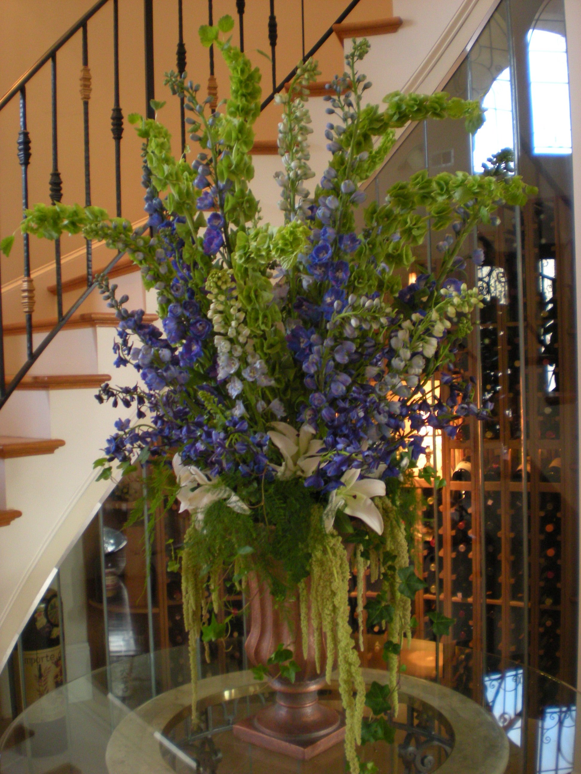 Bronze Urn with Delphinium, Bells of Ireland, White Oriental Lilies, Hanging Amaranthus, Ivy, Plumosa.jpg
