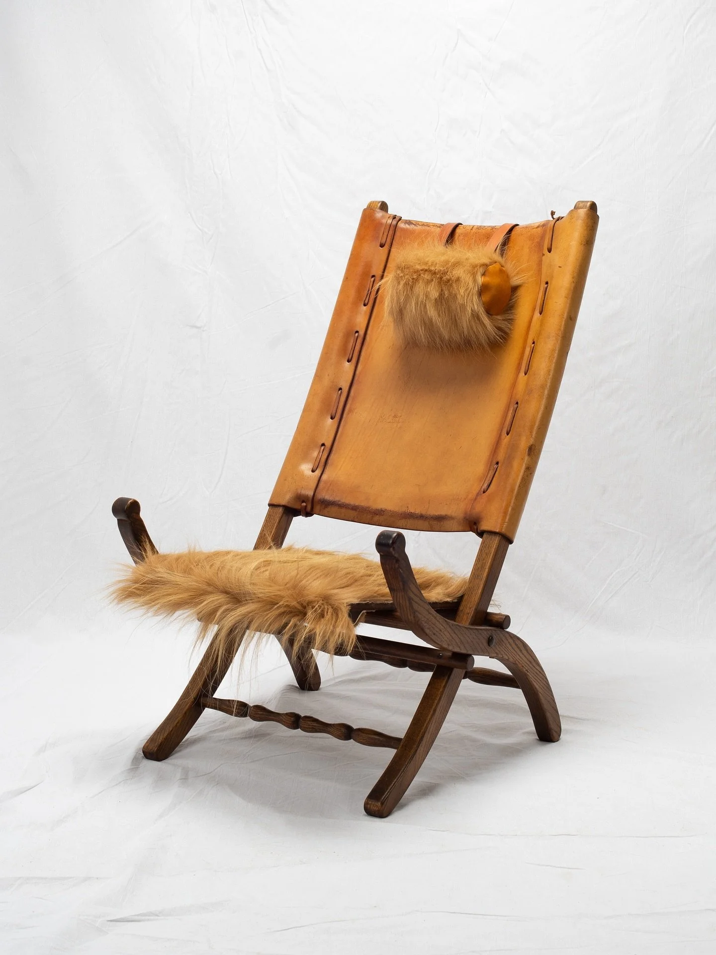 Spanish Campaign Chair
Mid-20th Century, Unknown (presumed Spain)

Hair-on-hide upholstery and custom neck pillow.
22 1/8&rdquo;W x 27 1/2&rdquo;D x 36 5/8&rdquo;H

#furnituredesign #furniturerestoration #collectibledesign #vintageinterior #vintagech