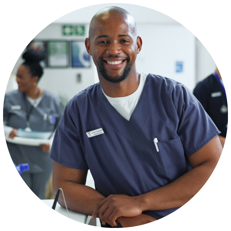 proud male nurse smiling at the way that his hospital operations are optimized