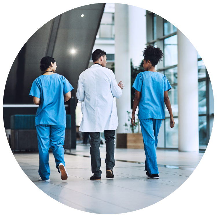 Healthcare leaders walking through an optimized emergency department waiting area