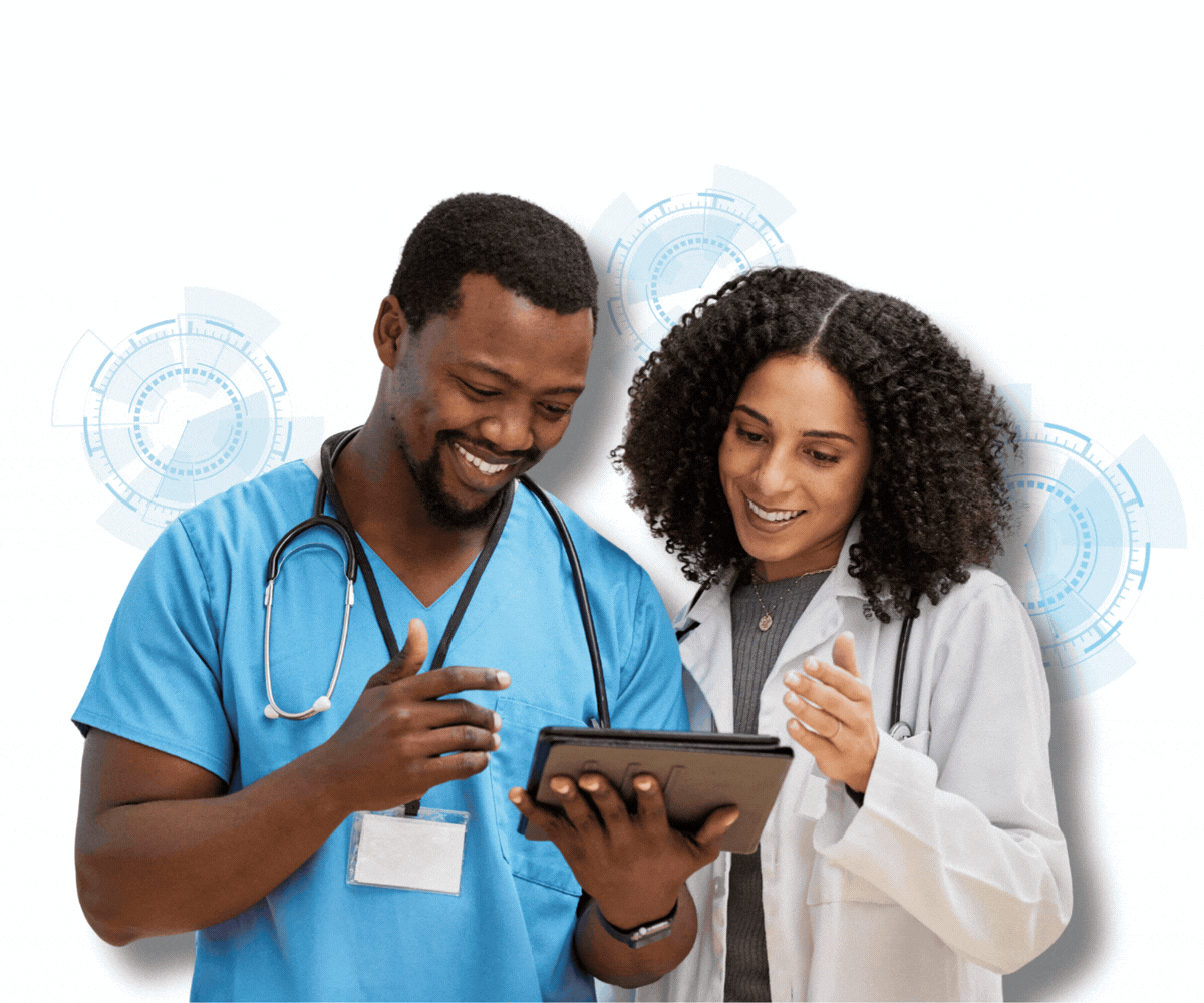 Two medical professionals, a male nurse in blue scrubs and a female doctor in a white coat, are looking at a tablet together and smiling.
