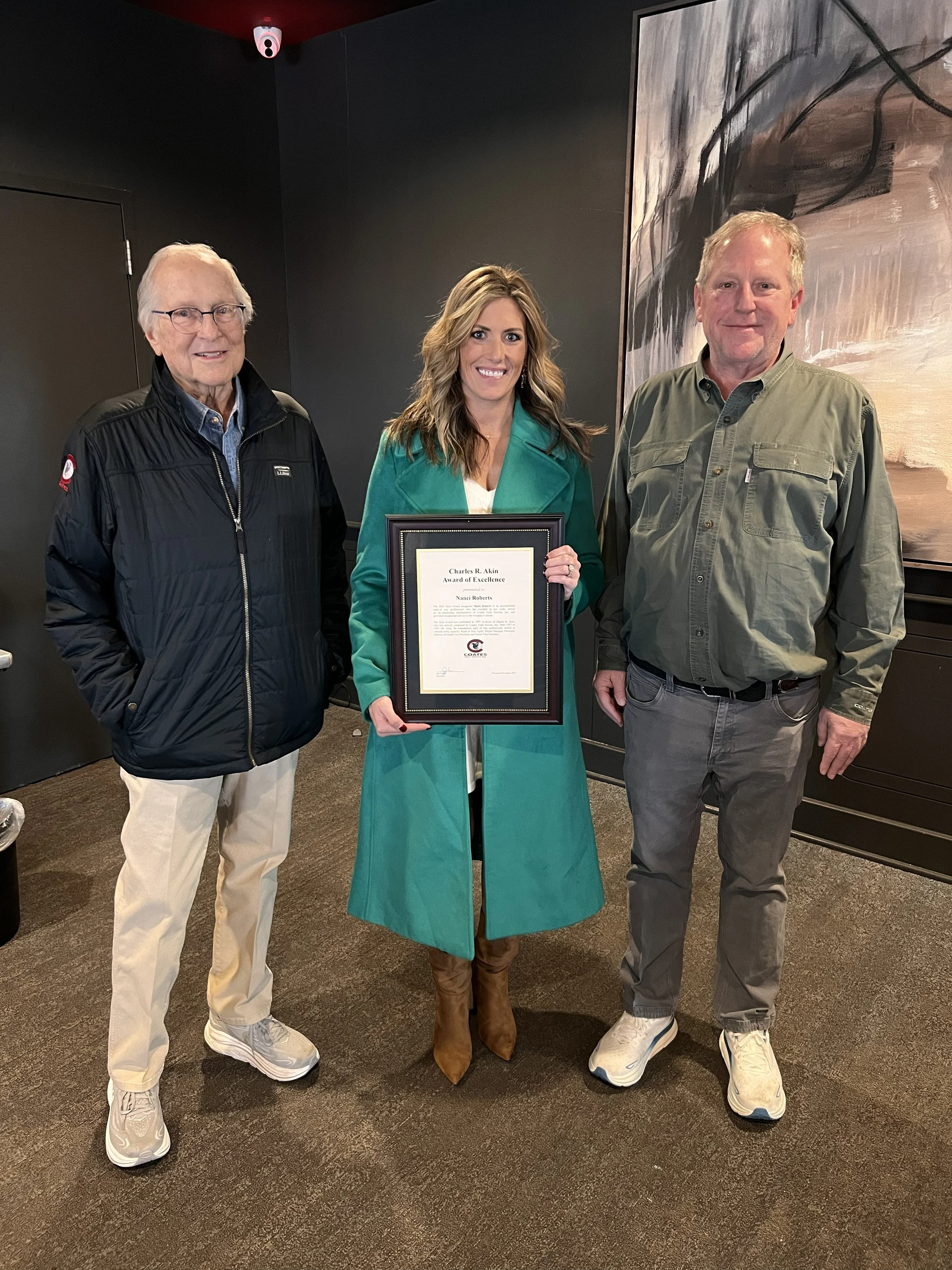 Nanci Roberts with John (left) and Joe Coates