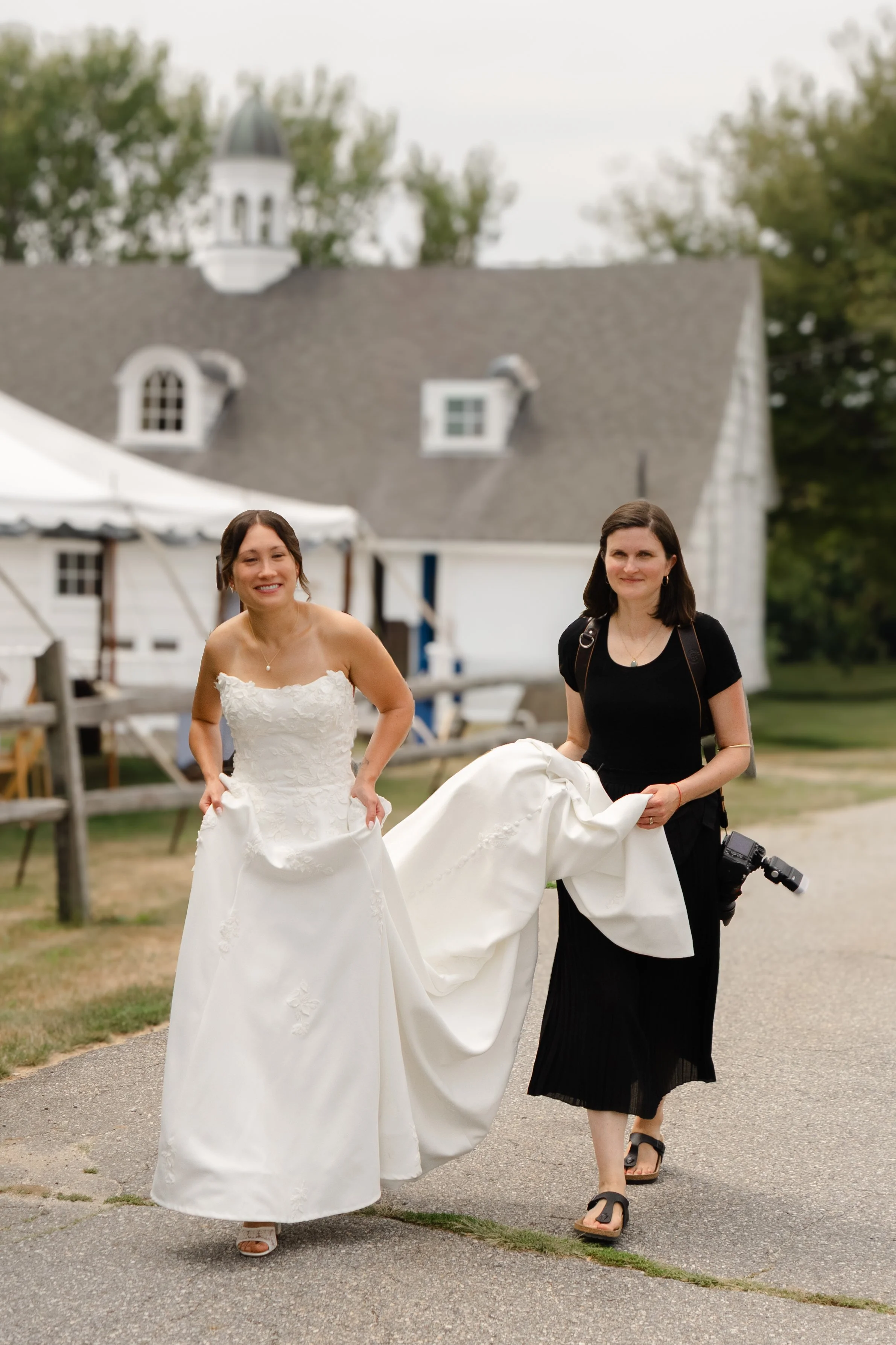 Bride and Groom hugging MOH after speech at Migis Lodge wedding in Maine