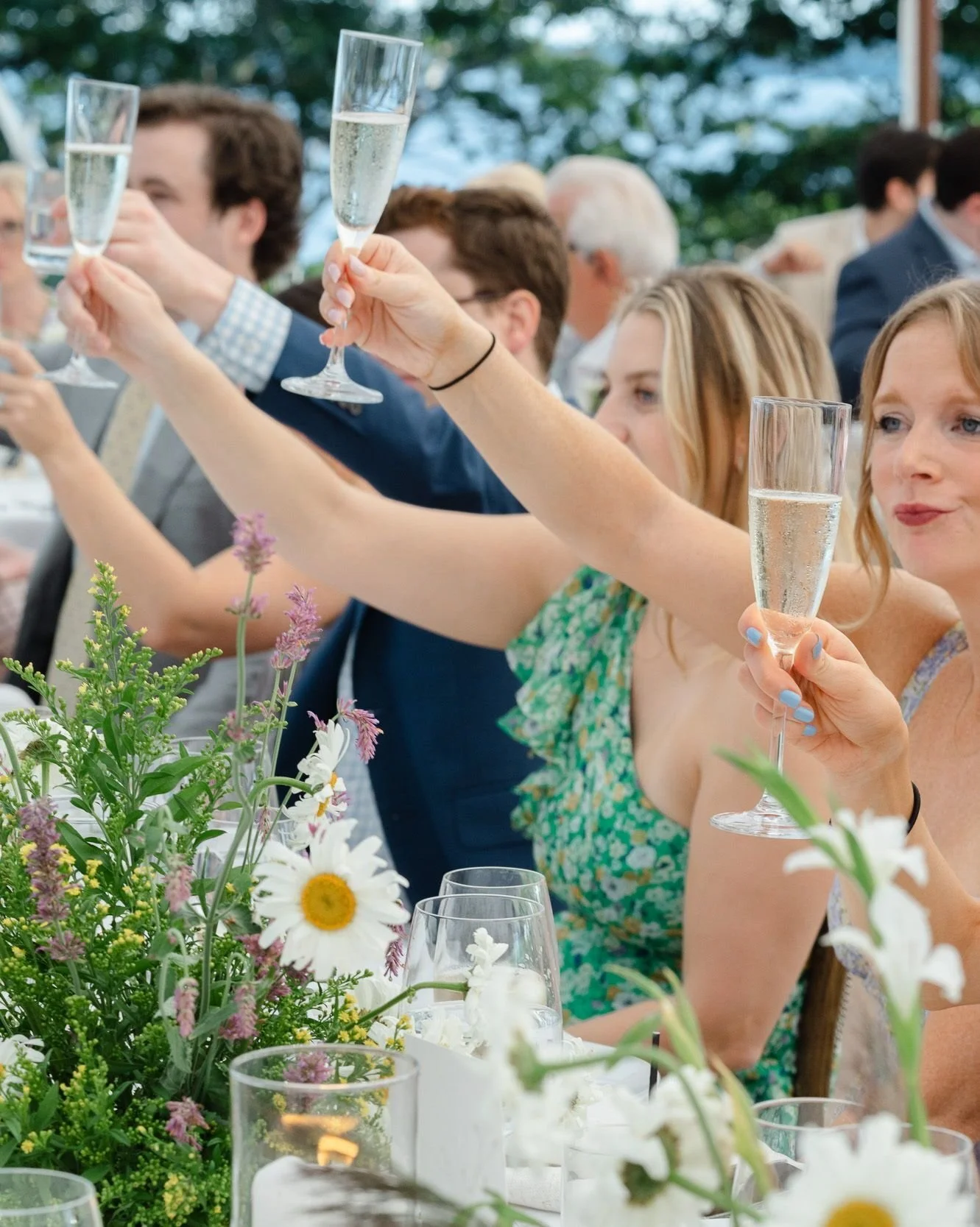 Toasts at French's Point. Wildflowers, champagne, and a whole lot of love.