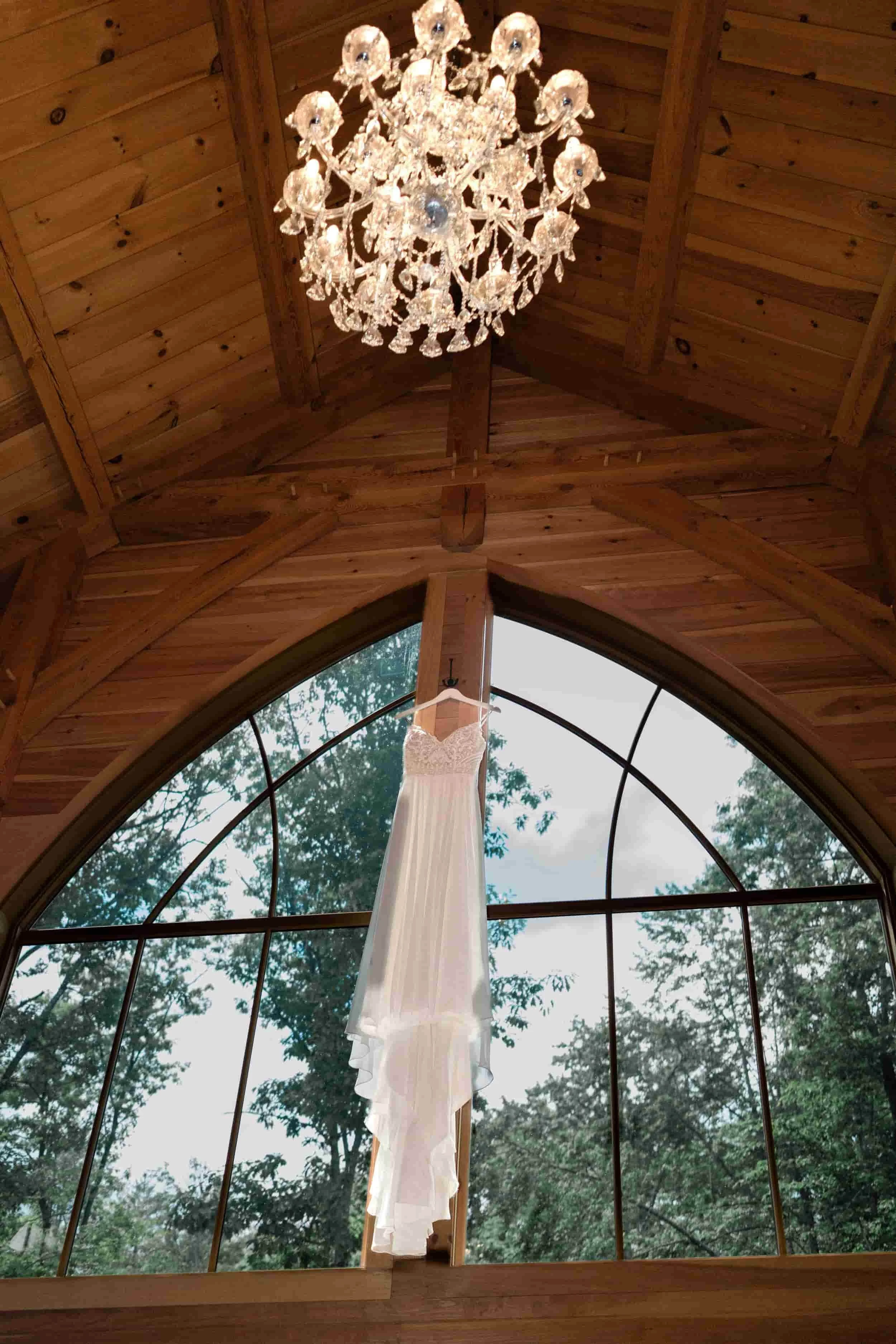 Wedding dress hanging in the lodge window at Old Saco Inn.