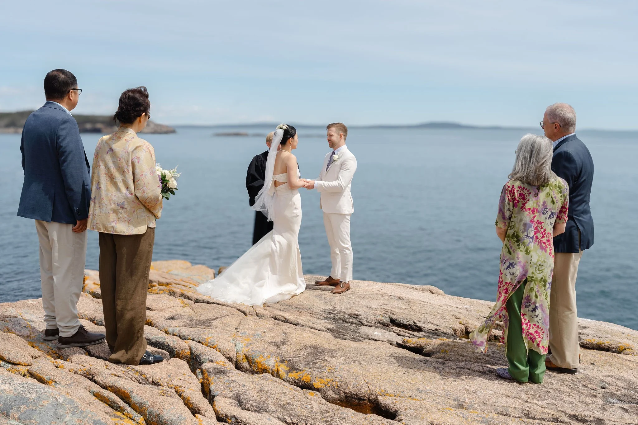 Bride and Groom during elopement ceremony in Acadia National Park in Monument Cove