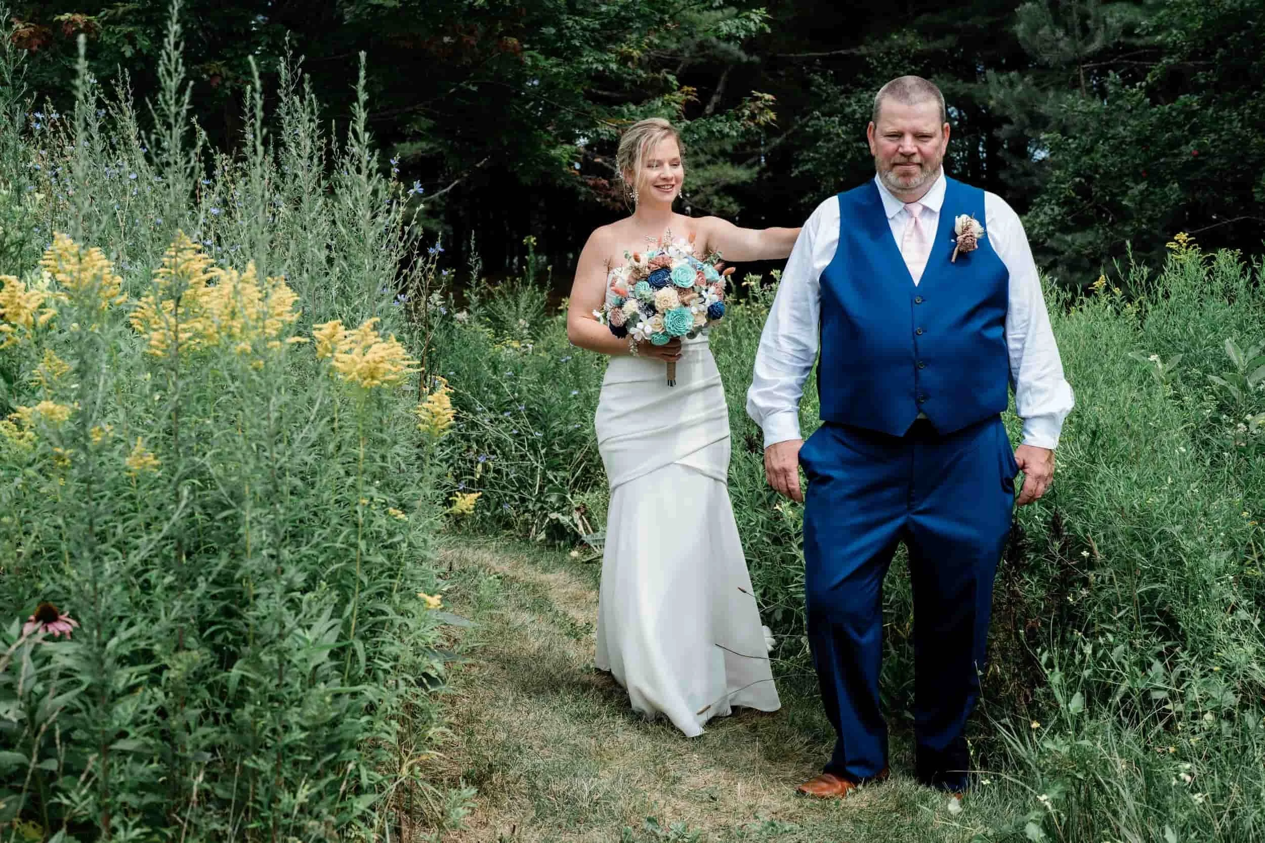 Bride walking down aisle with her father at coastal Maine wedding.