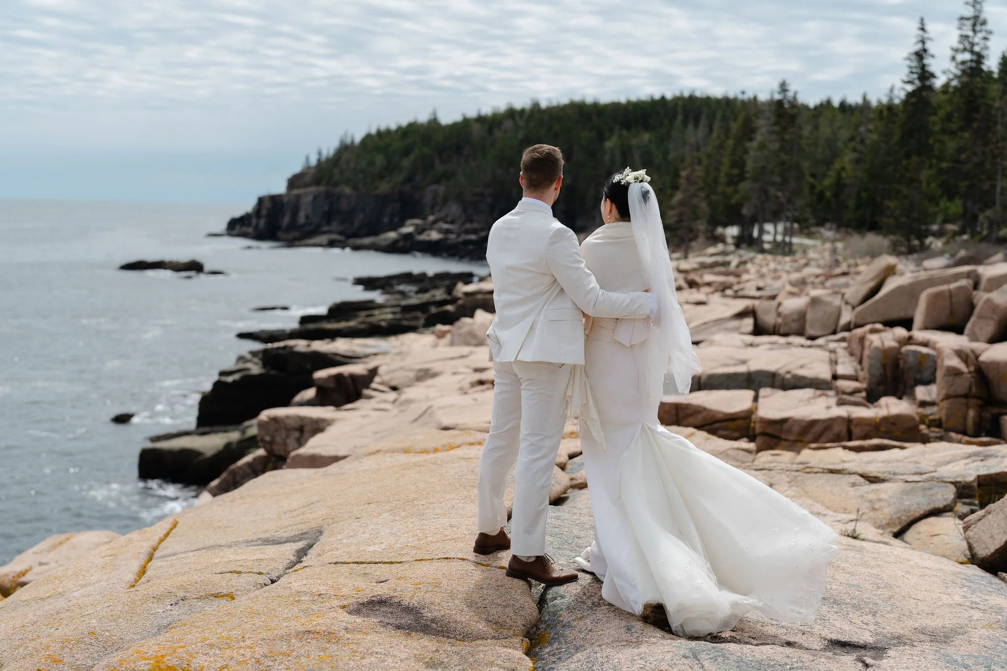 Bride and Groom Looking out at Acadia National Park