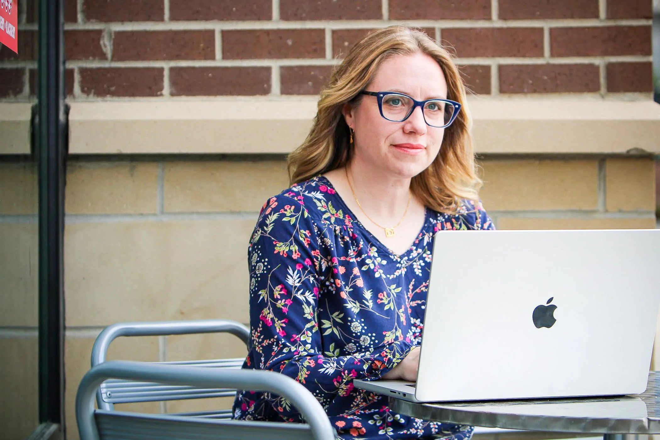 Kristin working on a computer.