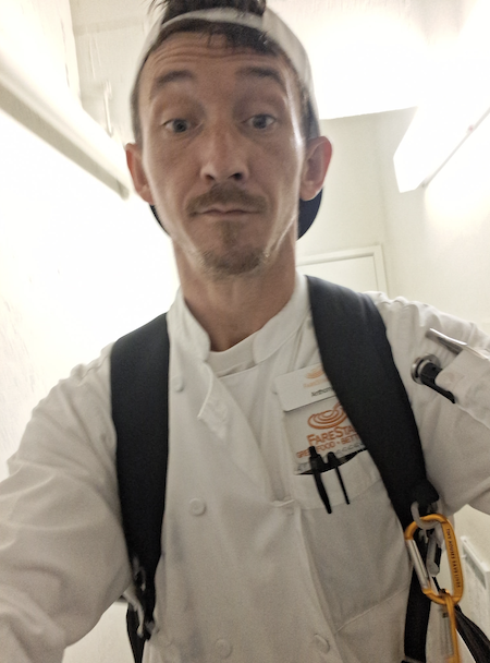 Anthony, the subject of the story, taking a selfie in his FareStart chef's coat