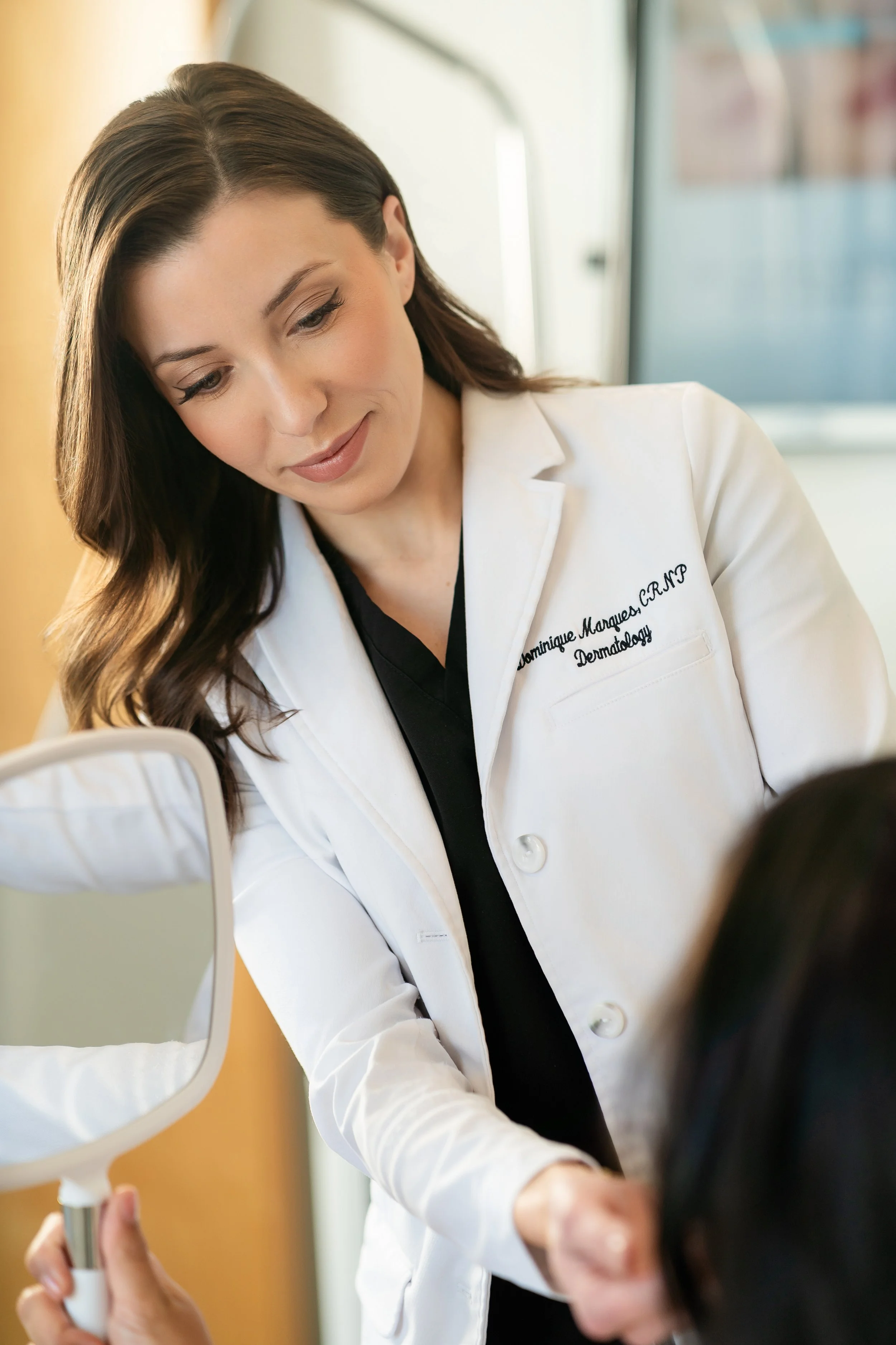 Photo of a Nurse Practitioner working with a patient at a Medical Spa and Dermatology Office